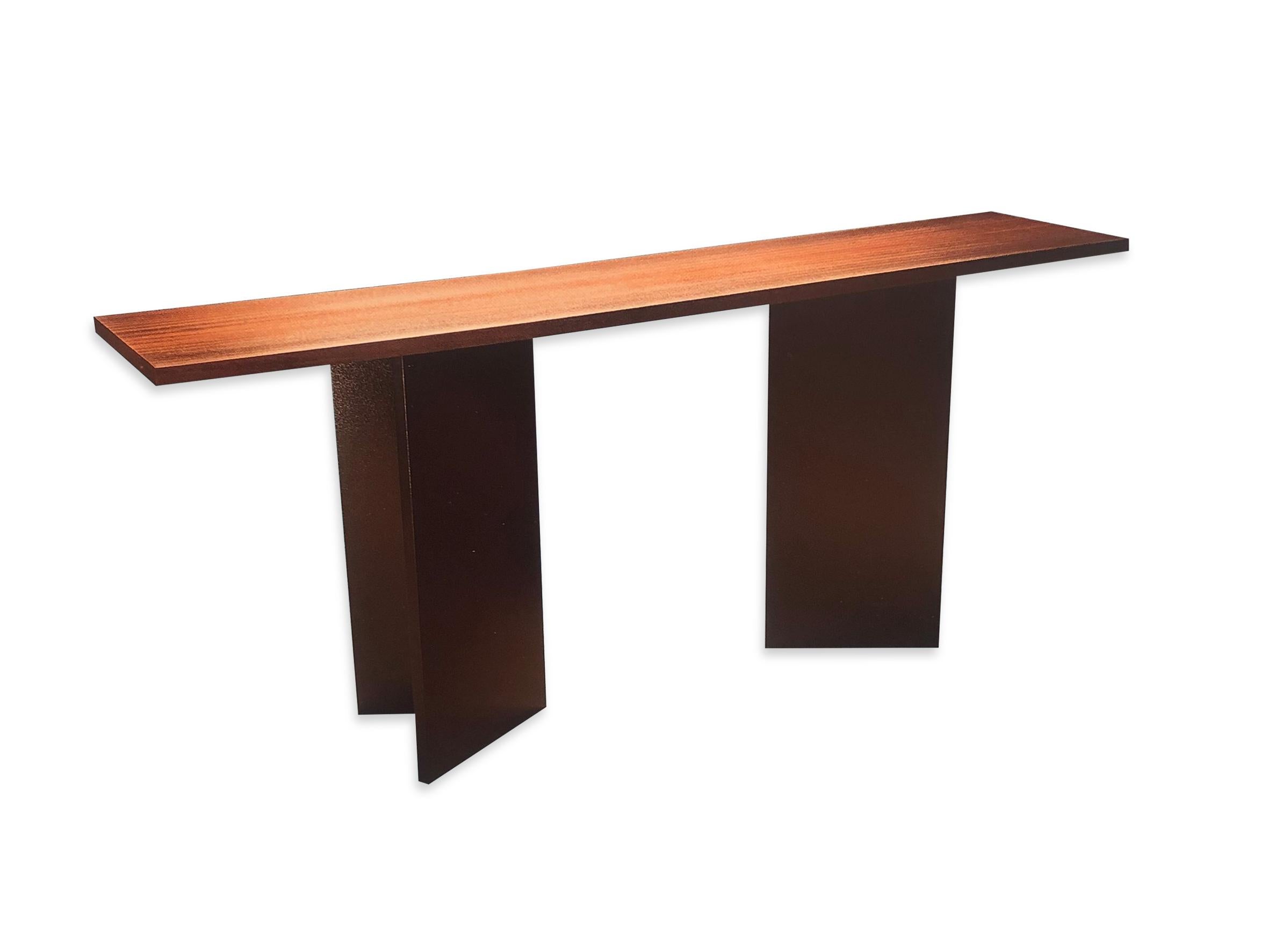 This elegant metal and wood console table was designed by Jun Montoya. This exquisite piece was part of his 2015 furniture collection. 

Property from esteemed interior designer Juan Montoya. Juan Montoya is one of the most acclaimed and prolific