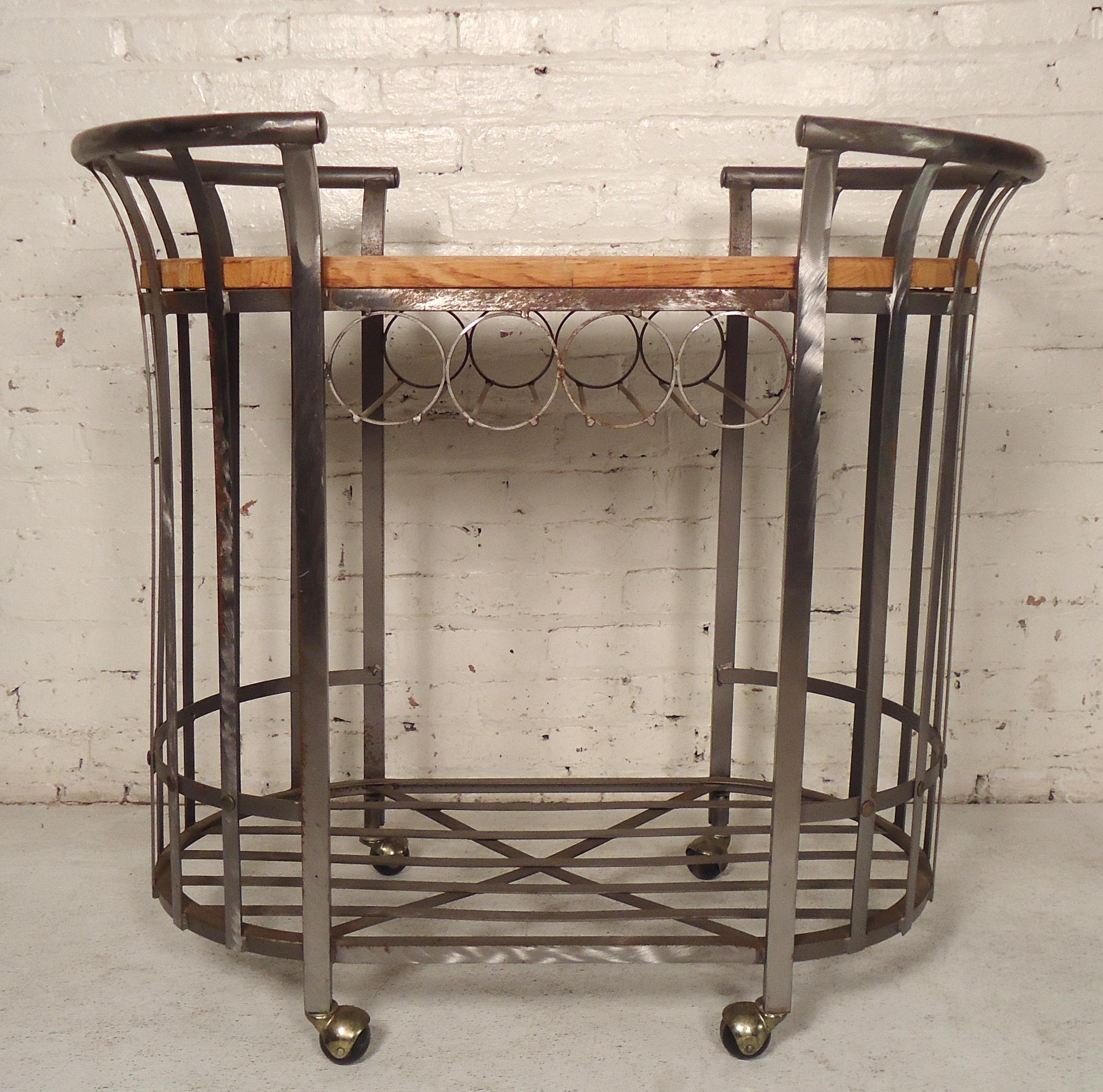 Metal cart with brush finish and butcher block wood top. Features lower shelf and wine rack.

(Please confirm item location NY or NJ with dealer).
 