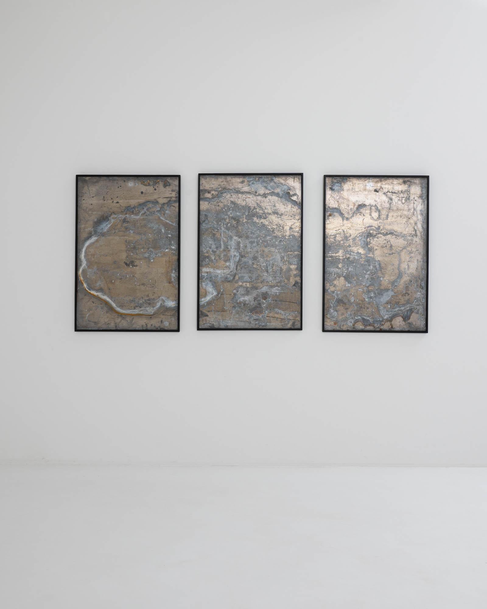 A set of three metal artworks with wooden frames. The clean black frames of these three decorative artworks allow the textured maximalism of the pieces to shine, bringing forth the mesmerizing network of details in stark relief. Tendrils of silver