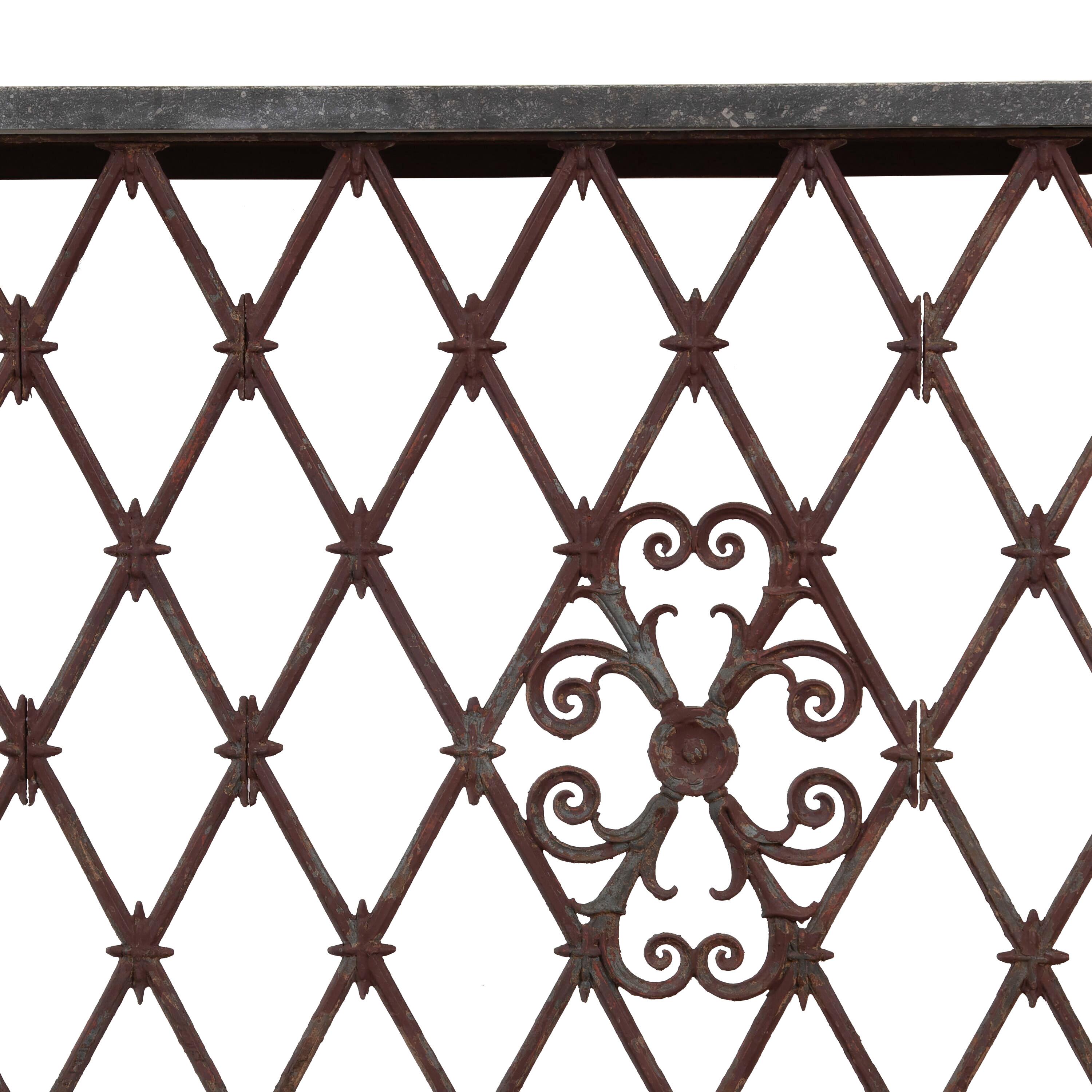 19th Century iron work balcony converted to a console.
This would work well as a radiator cover but can be used both inside and out.
Featuring a decorative harlequin design in the ironwork and original patina.
The top is made of Belgium blue