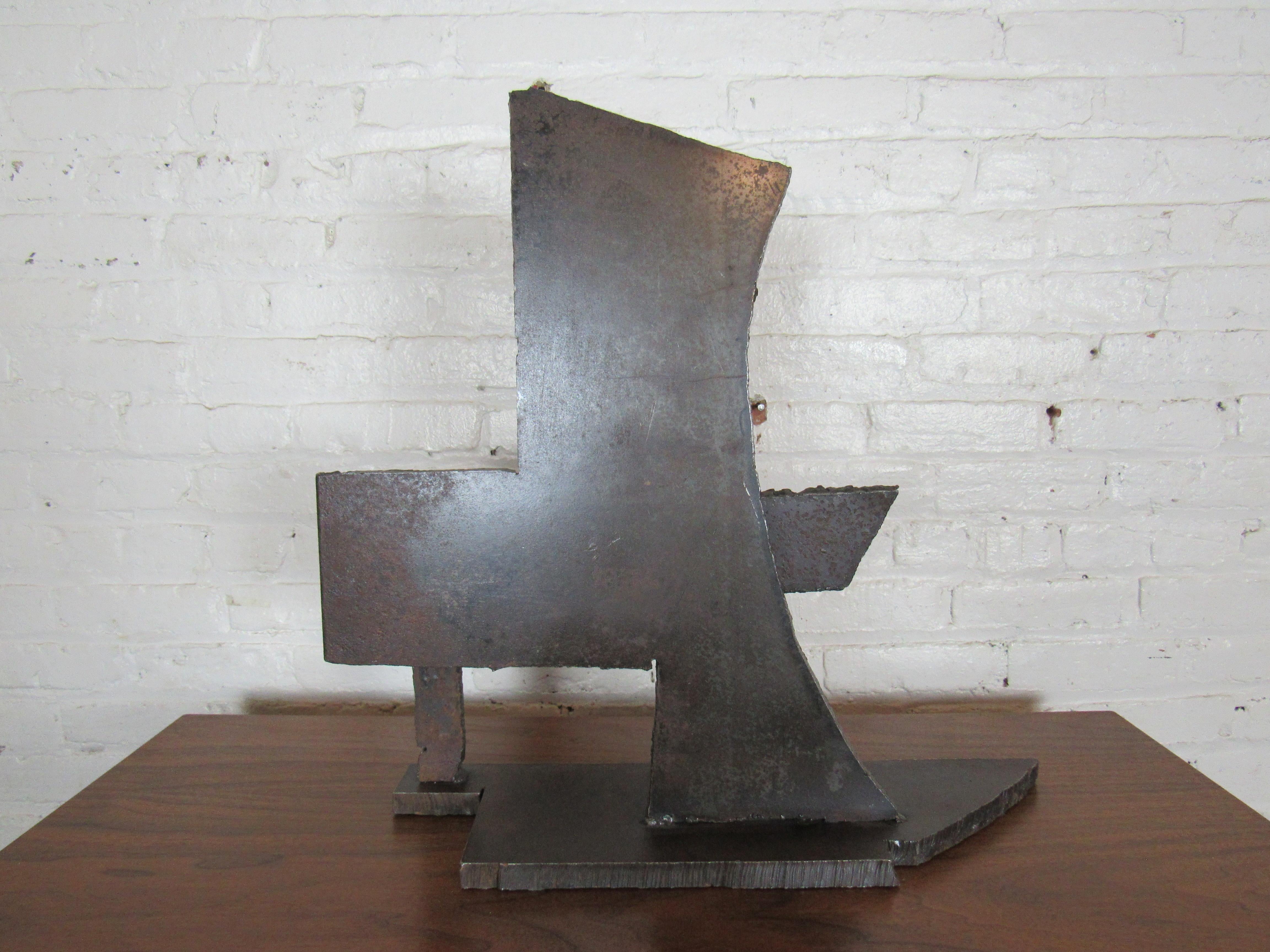 A heavy welded table-top sculpture featuring abstracted metal shapes. Please confirm item location with seller (NY/NJ).