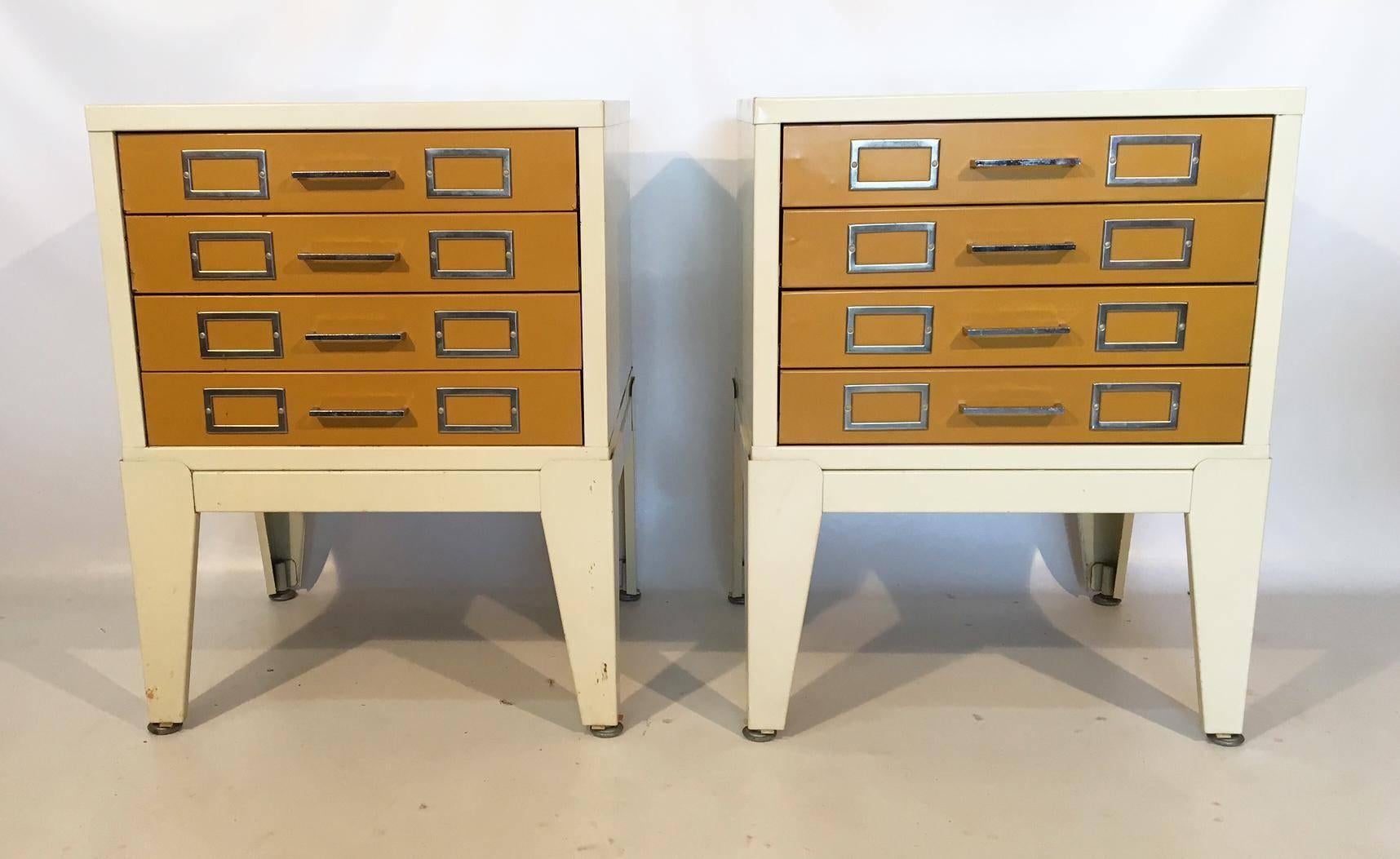 Pair of vintage metal cabinet nightstands featuring four drawers and all-steel construction. Excellent vintage condition with only minor abrasions from careful use.