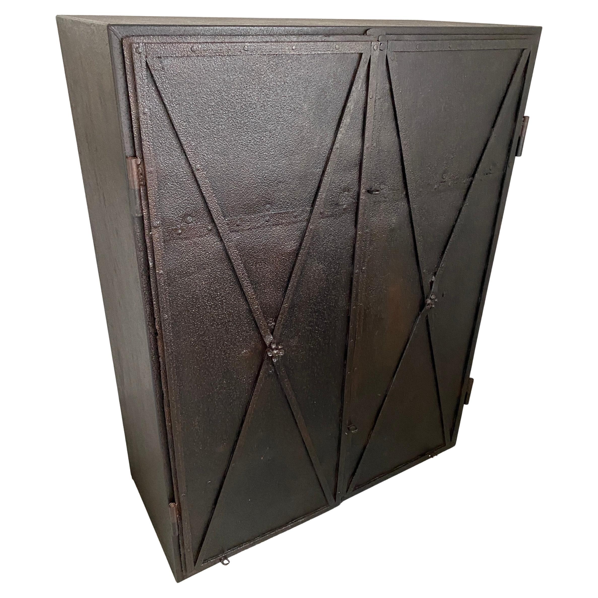 These Directoire period metal doors were once window shutters on an 18th century French chateau that now have been repurposed and made into doors for this cabinet which can lend itself to many uses such as a bar or storage cabinet. The doors are