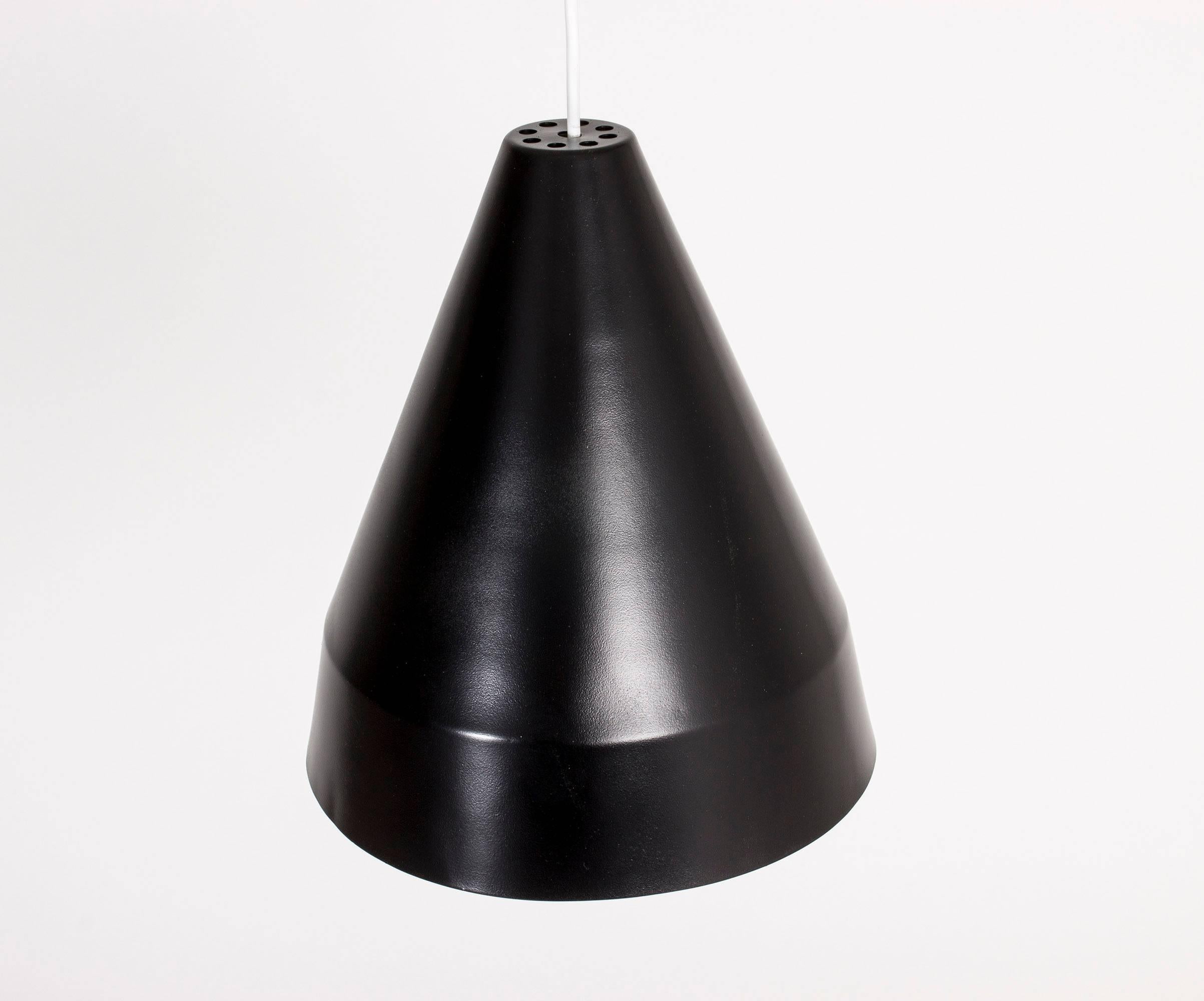Sleek metal ceiling lamp by Alf Svensson with black lacquered outside and light grey metal inside.