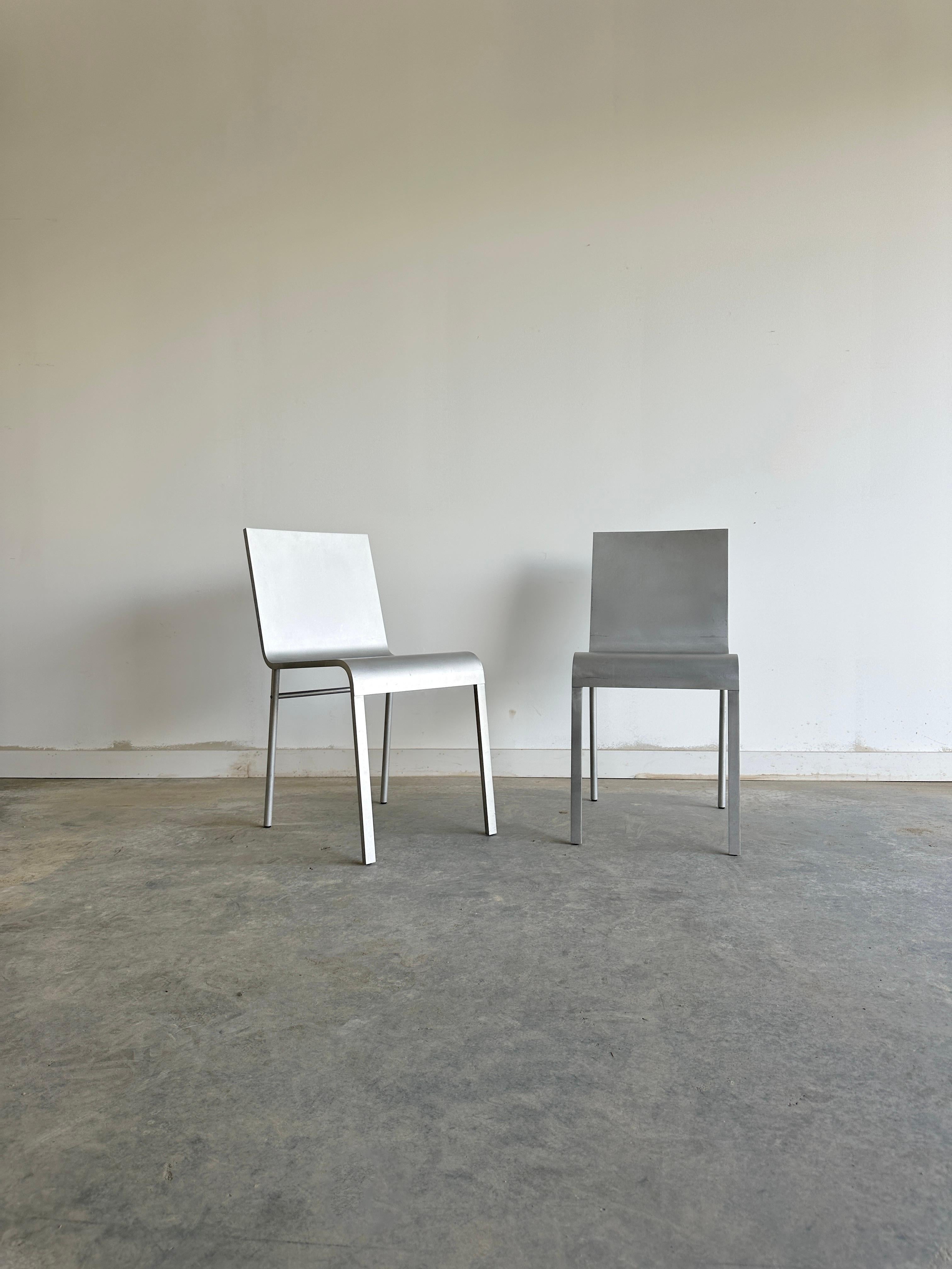 A pair of Maarten van Severen CN° II chairs is a rare and exciting find for any design lover. These chairs were created in 1992 by the Belgian designer, who was known for his minimalist and refined style. The chairs are made of bent aluminum sheet