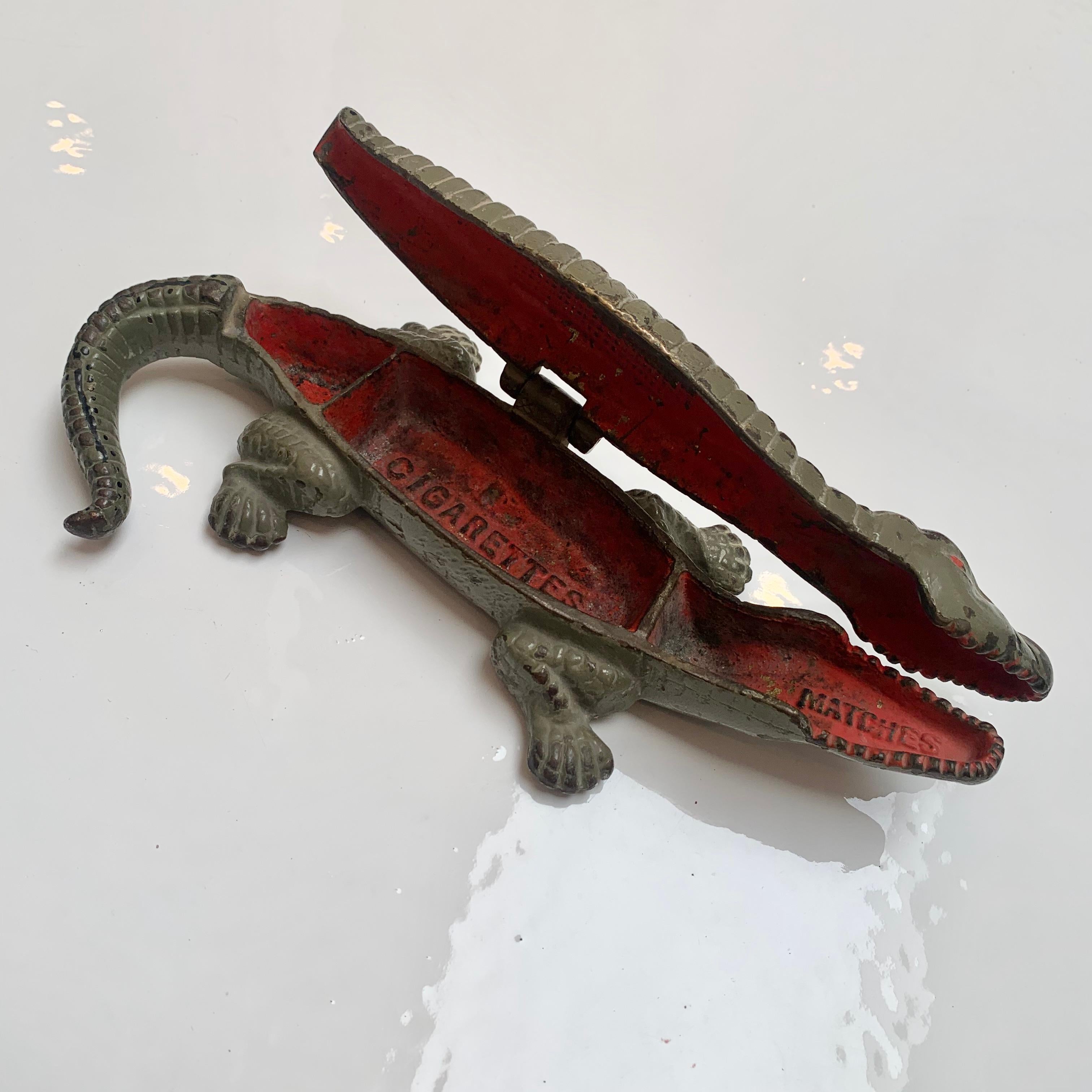 Great sculptural crocodile box. Originally made to hold rolled cigarettes and matches. Great ashtray or pillbox. Large-scale. Measure: 9.25