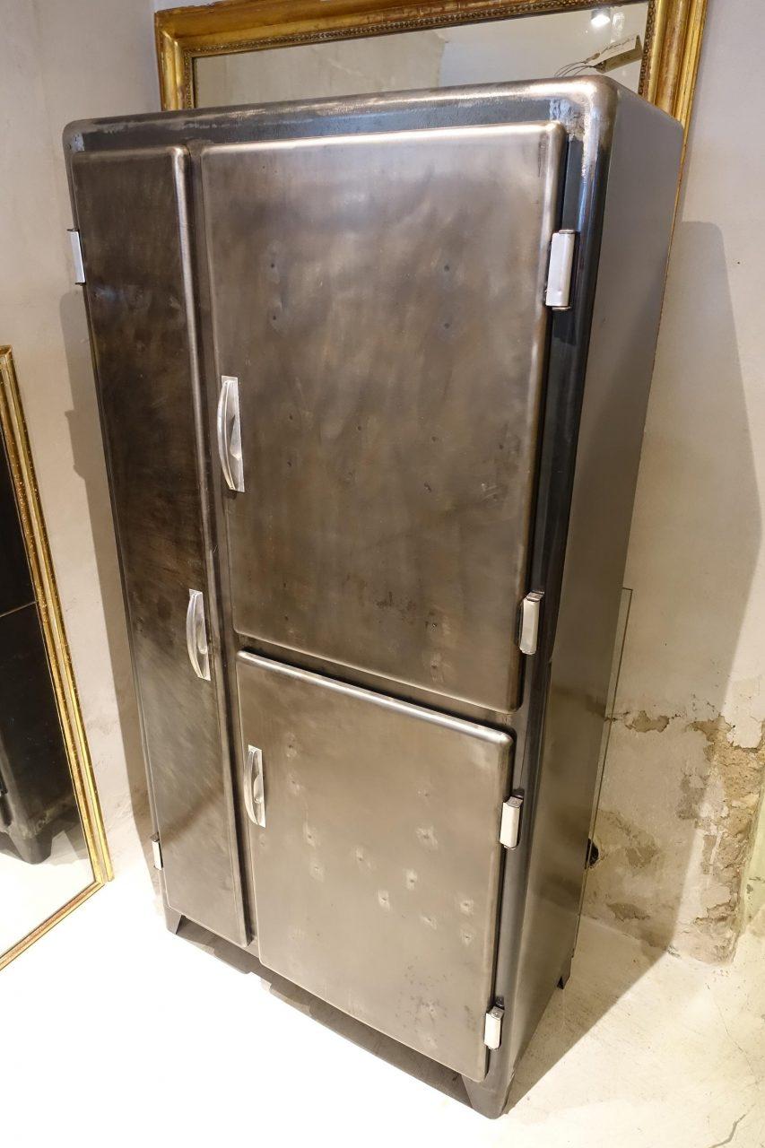 Beautiful vintage kitchen cupboard / wardrobe from 1950s, France. It has been restored and treated and polished to a gorgeous dark metal sheen. The three doors at the front are different shapes. Inside, the closet consists of fascinating storage