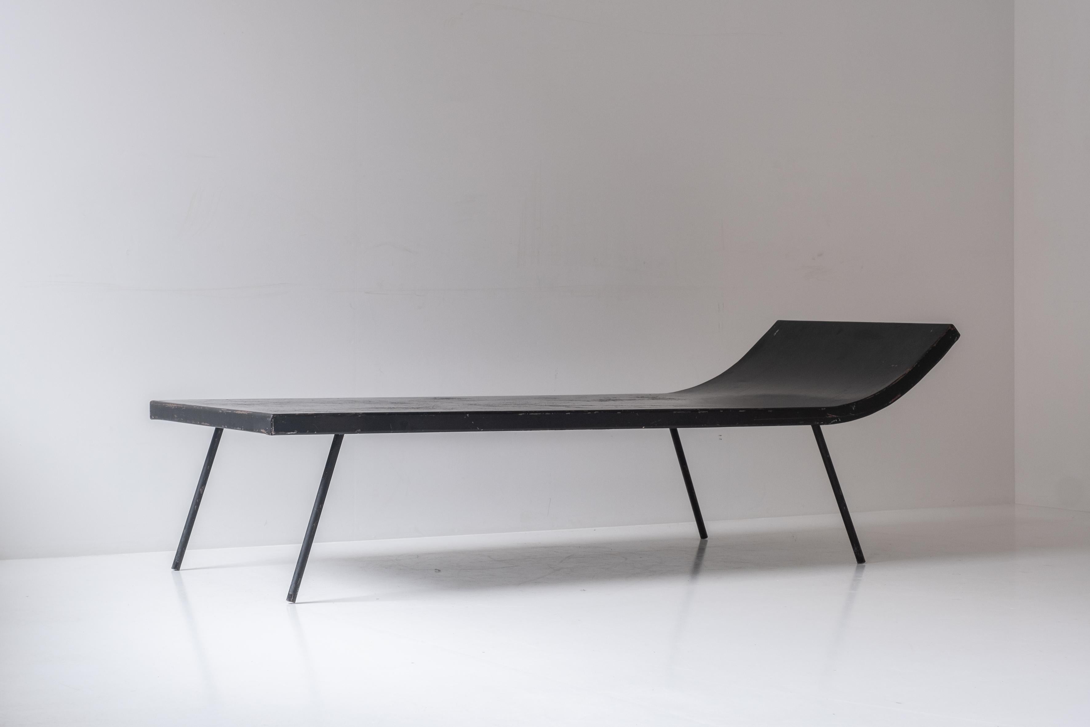 Metal daybed designed and manufactured during the 1950s. This decorative and functional daybed is made out of black lacquered metal. Presented in its original condition with visible signs of age and use. Designer (for know) unknown.
