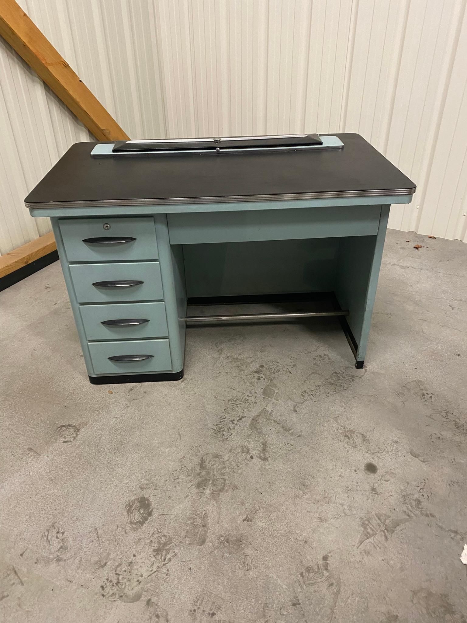 Metal desk, top covered with faux leather circa 1960
Maybe a former dentist's office.