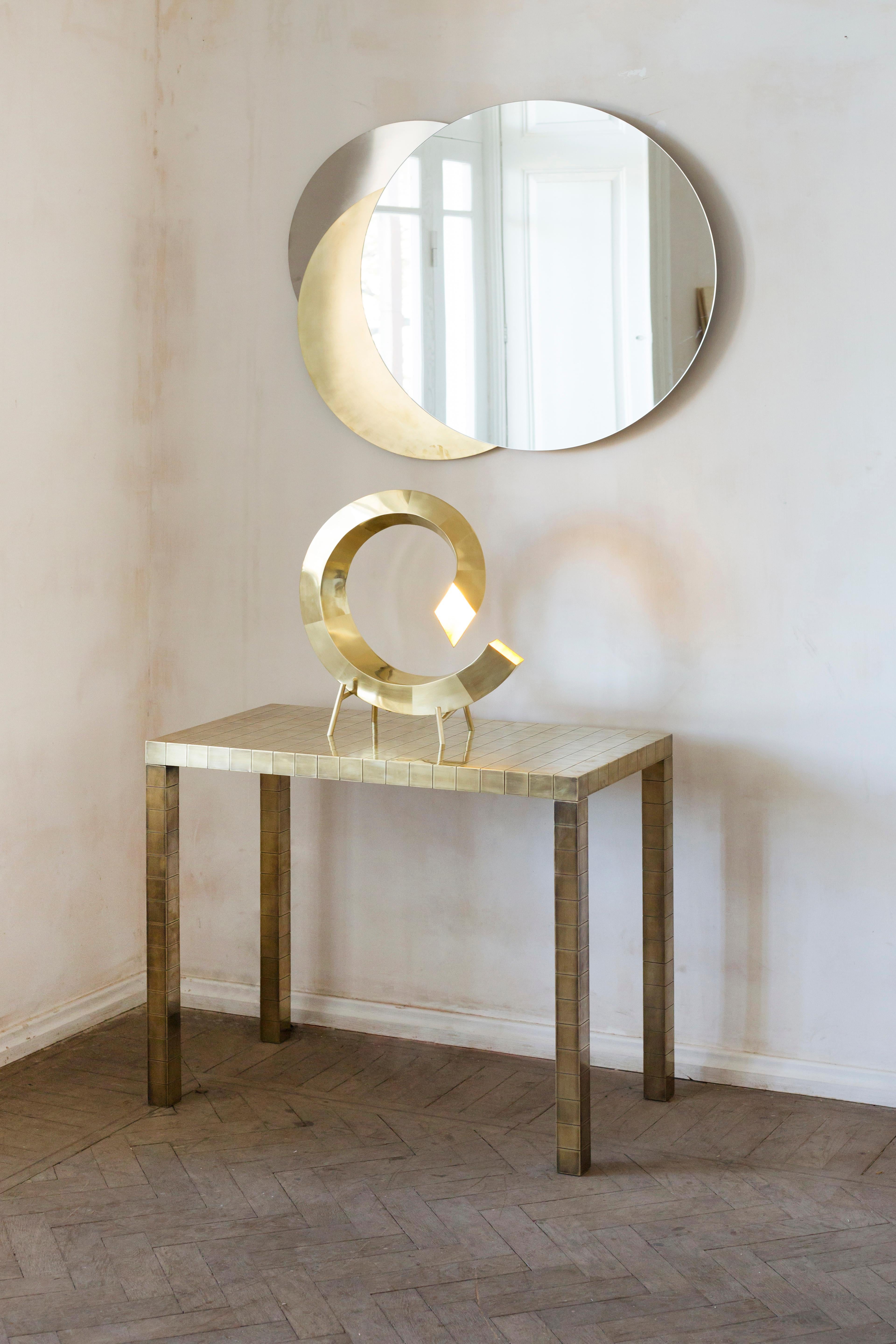 Metal Eclipse Mirror

Materials: Brass, steel, mirror 

Eclipse Mirror combines brass and steel discs with a round mirror placed in the front. With handcrafted simplicity, the Eclipse Mirror is a graphic depiction of an eclipse. The wall scone turns