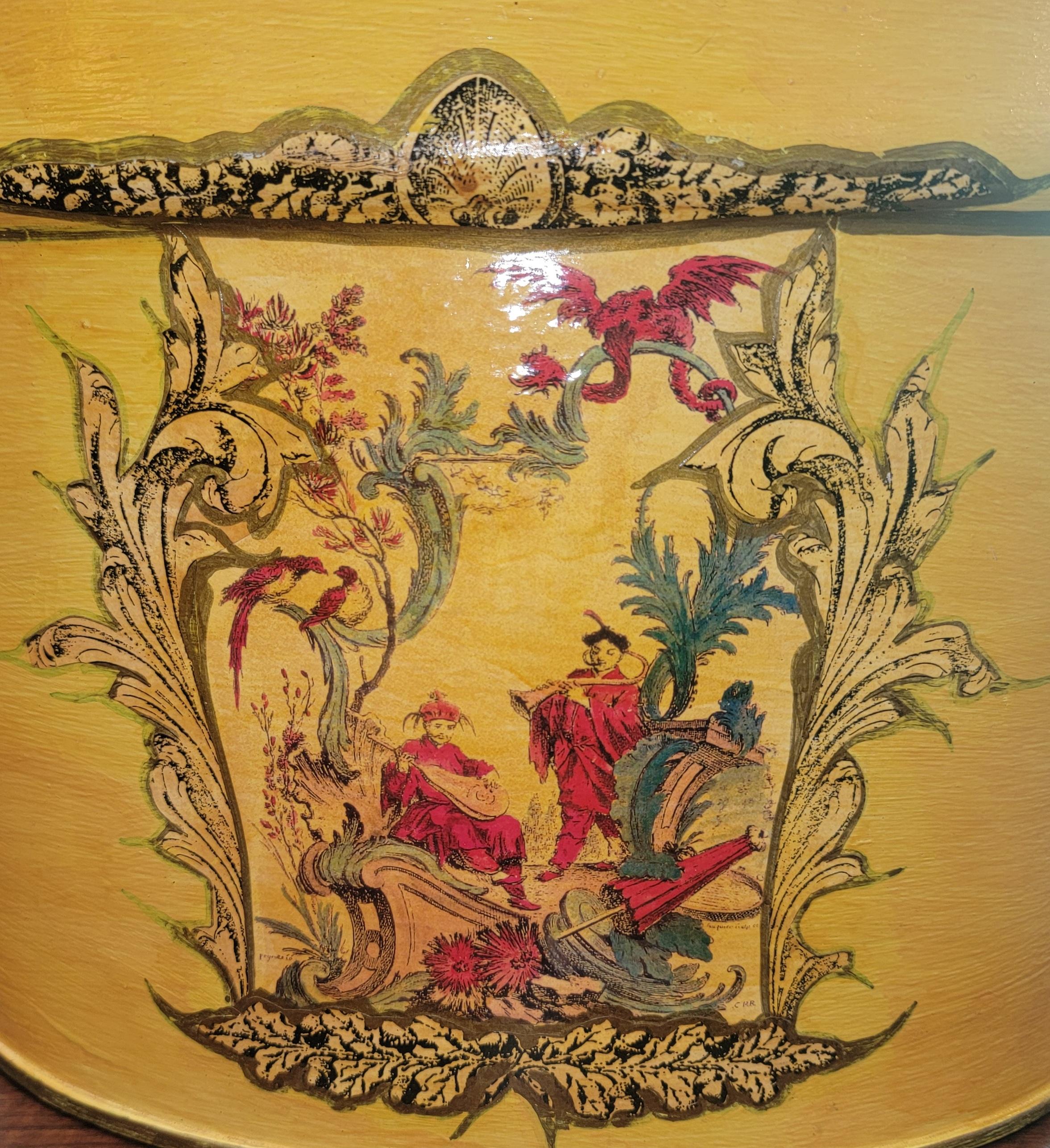 Wonderful painted metal and iron handle bucket. The front sides and back have a chinoiserie styled design. the colors are attractive and pop with the contrasting background.

Bucket measures approx - 16w x 10h x 10d 
when handle is down.

When