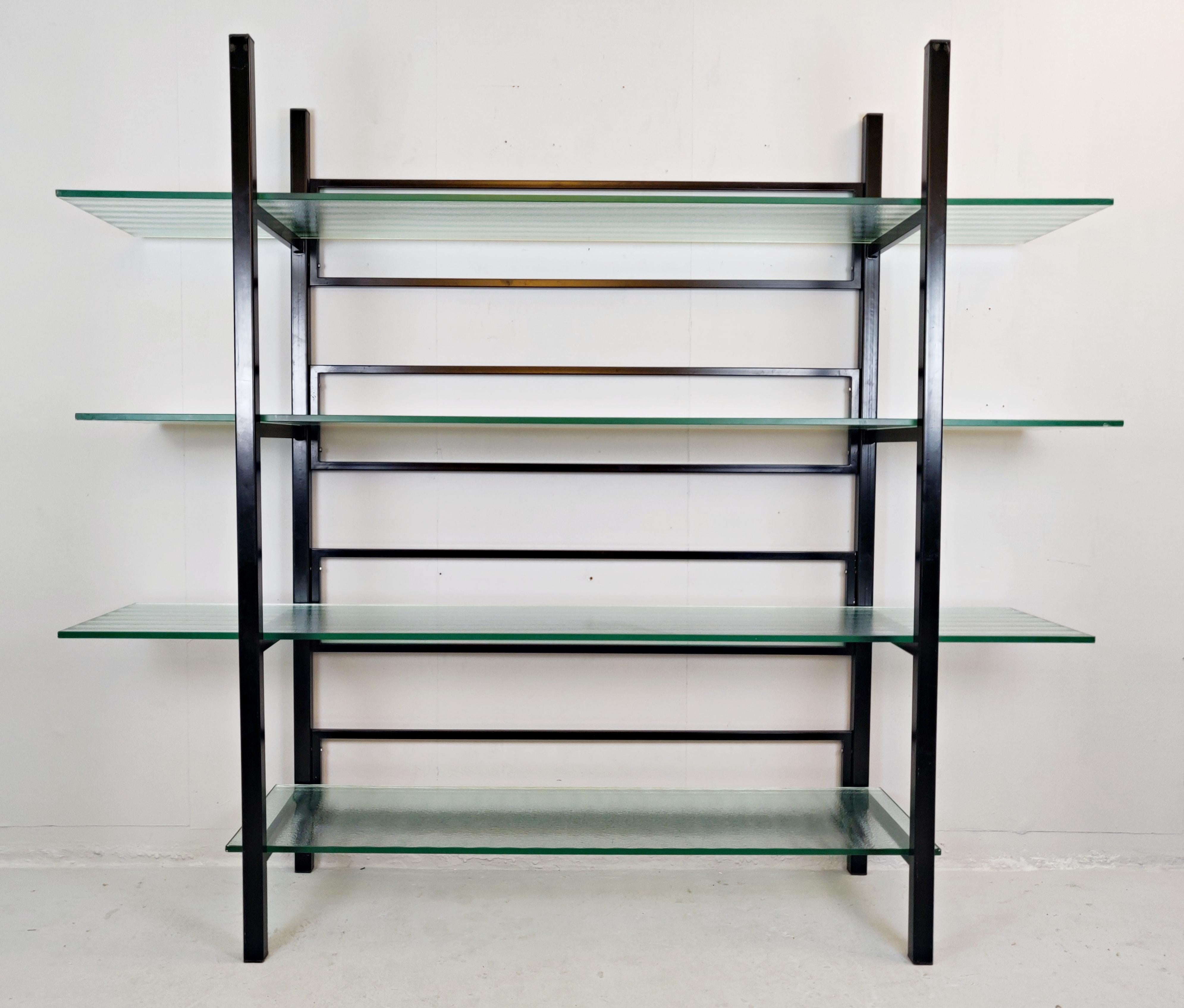 Metal étagère with four reeded glass shelves.