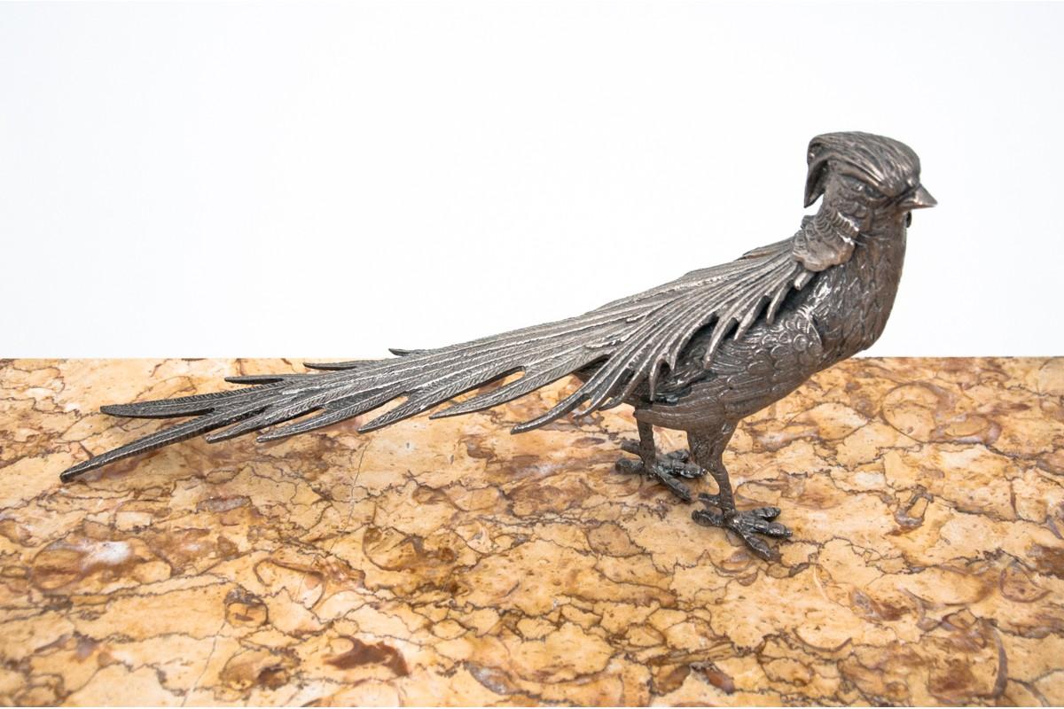 Metal figures of a pair of pheasants, a female and a male.
Dimensions: Height 17 cm, 16.5 cm / width 30.5 cm, 35 cm / depth 7cm, 7cm.