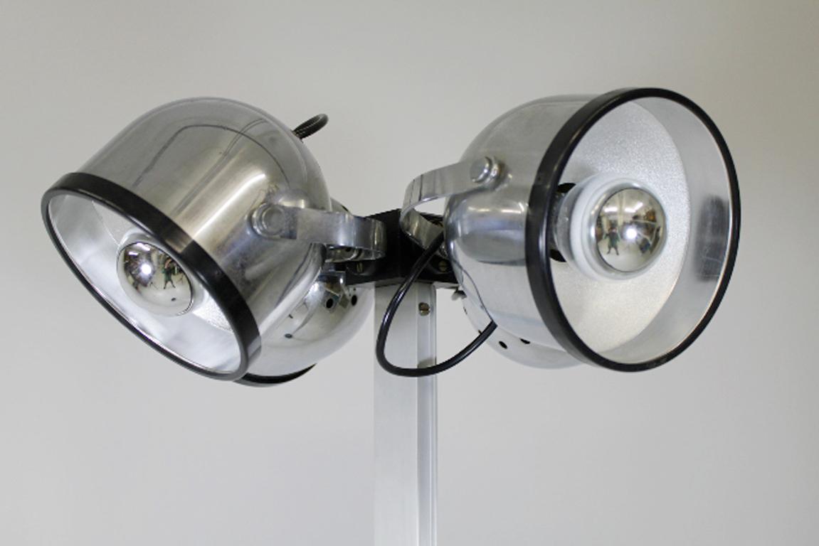 Gae Aulenti and Livio Castiglioni designed this floor lamp for Stilnovo in 1972.

It is made out of chromed metal and aluminium with cast iron base. The four round lights can be rotated in all directions.