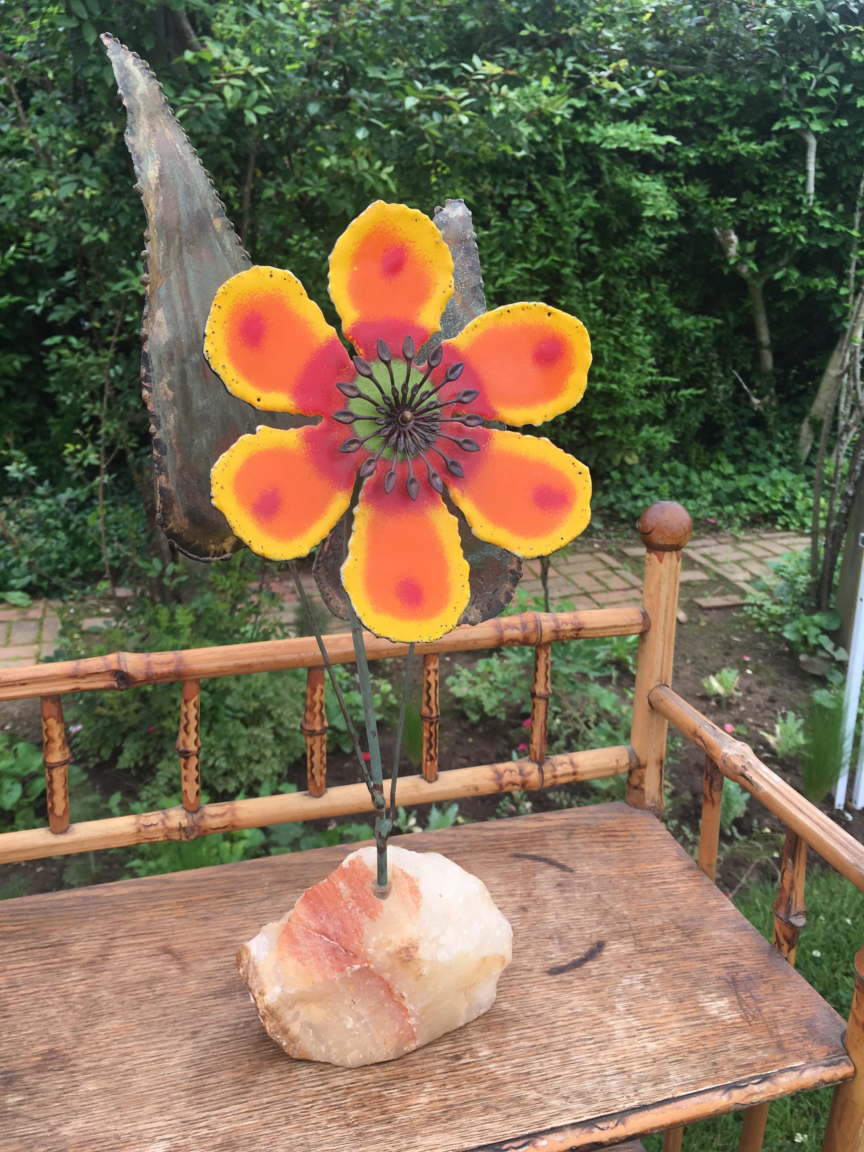 Metal flower sculpture signed by Curtis Jere.
Orange and yellow enameled flower on Verdigris patinated metal on rock stand.
Signed: C. Jere, 68'.
  