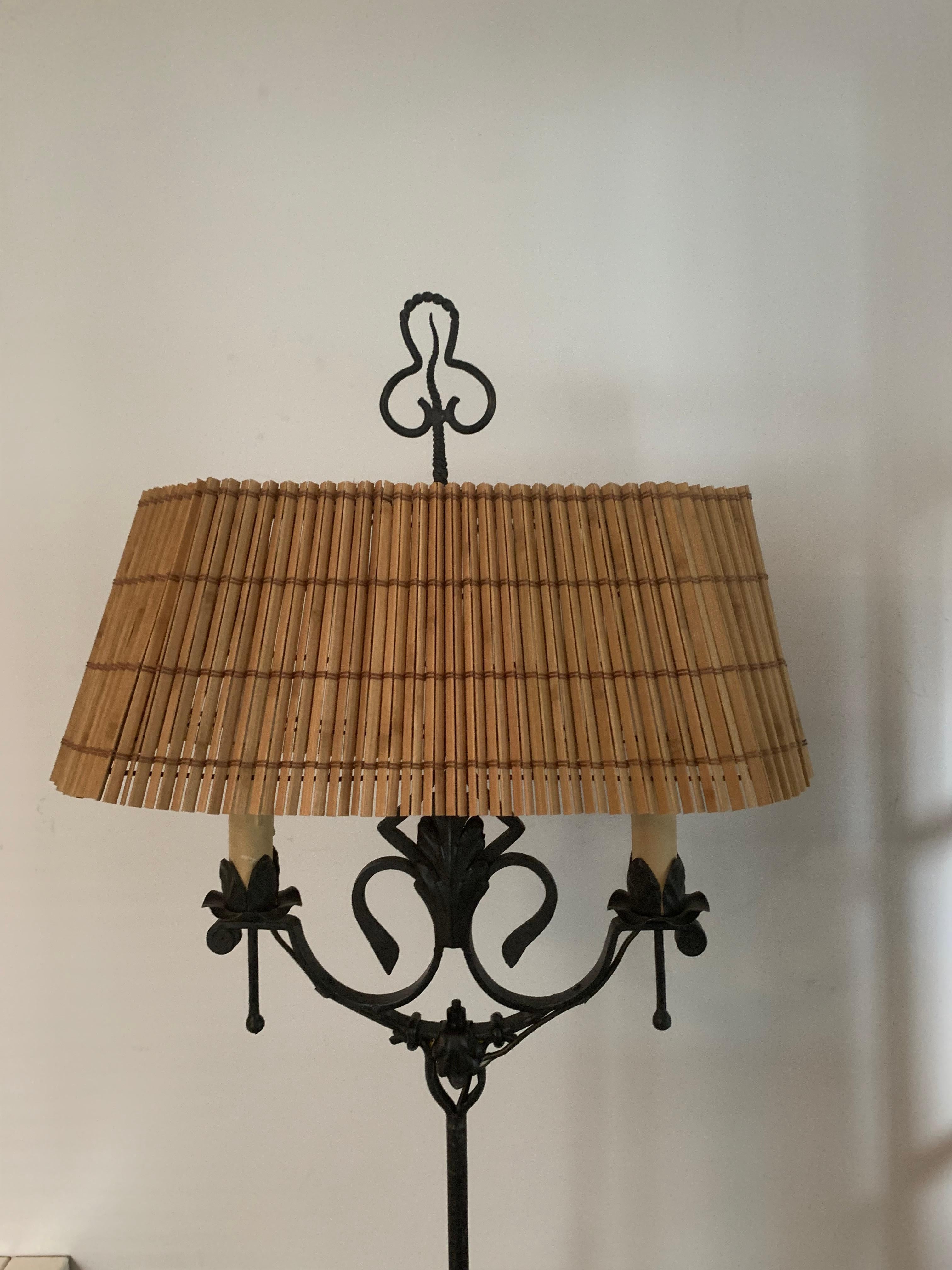 A wonderful lamp handcrafted by Finnish Art forge Antti Hakkarainen, the lamp has two light points and a wonderful wooden shade.