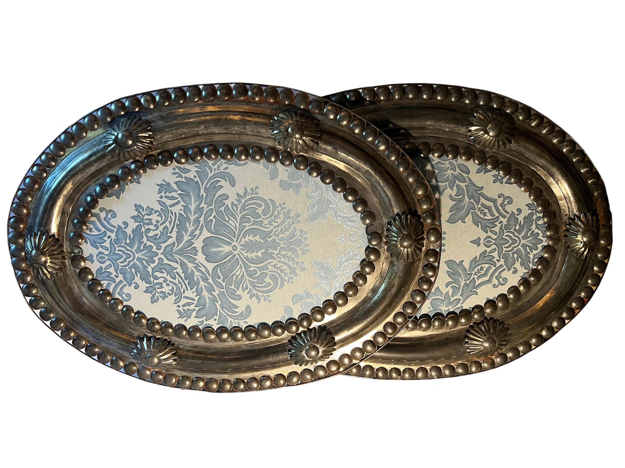 A pair of colonial metal framed blue damask hanging wall ornaments. Early 20th century.
