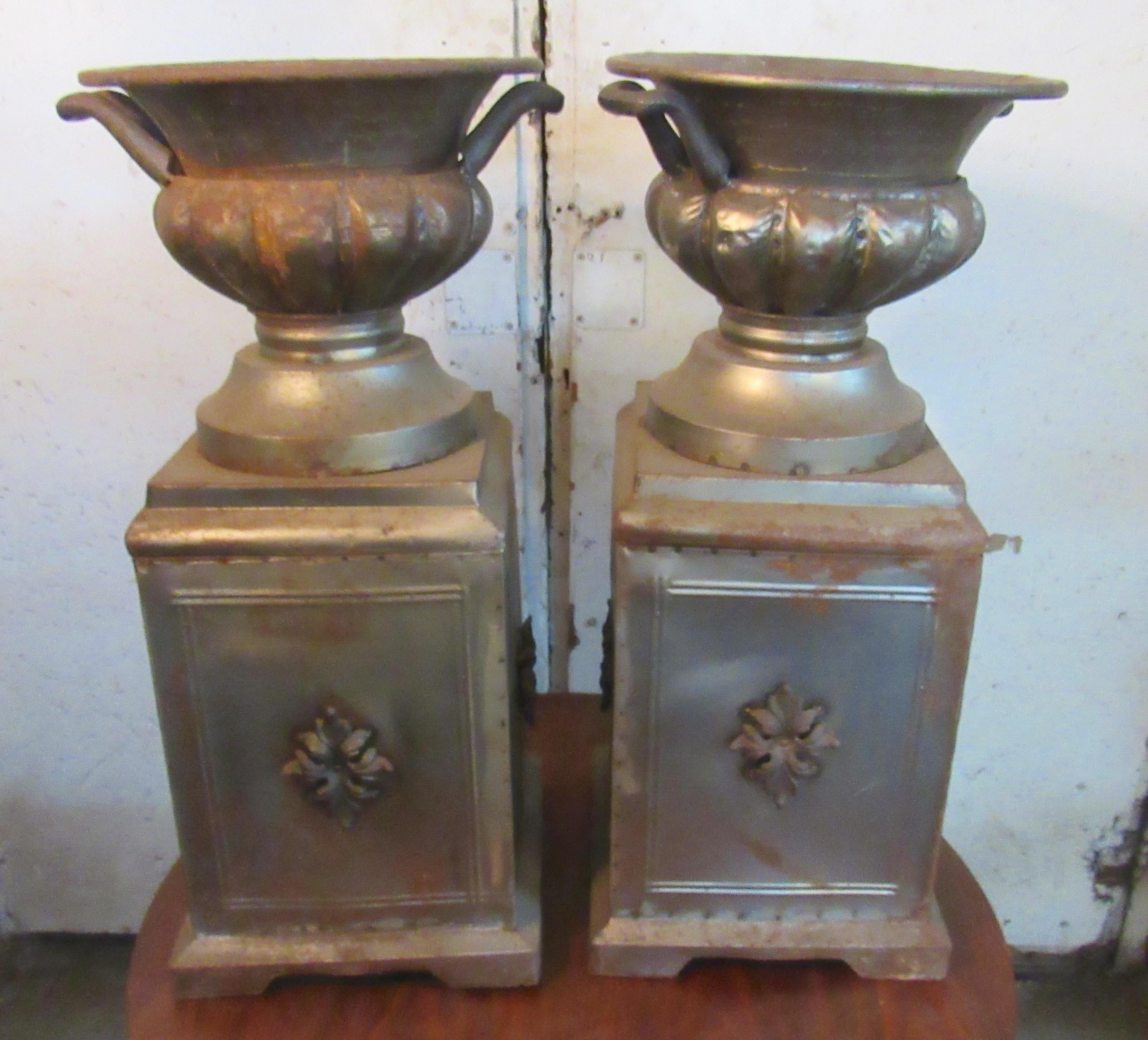 Pair of light weight metal garden urns. Decorative details and handles.
Please confirm location NY or NJ