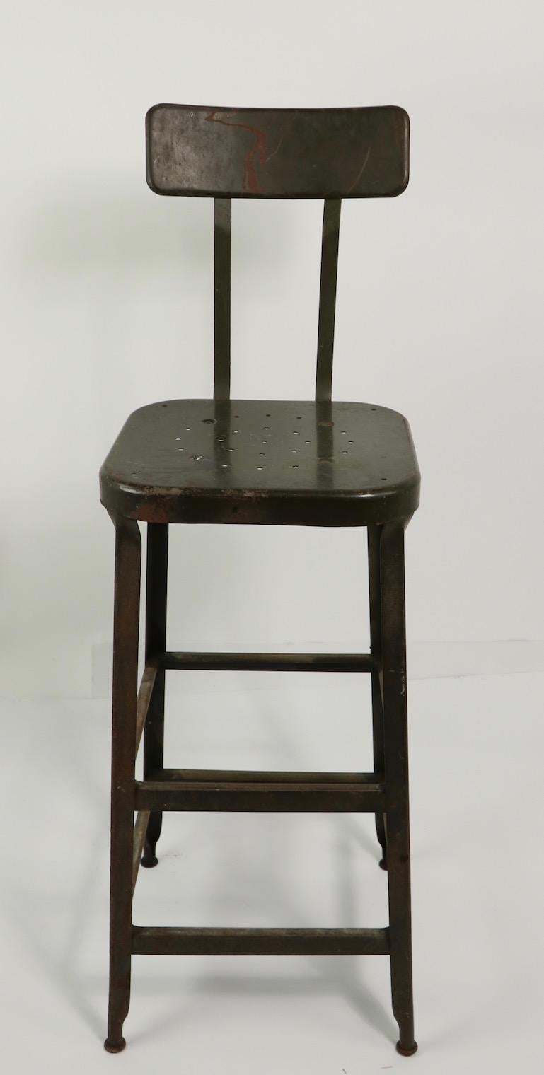 Industrial Design metal work, task drafting stool by Lyon Metal Products. Nice tall version suitable for Bar, counter or drafting application. This example is in very good, original condition showing only some cosmetic wear to finish, normal and