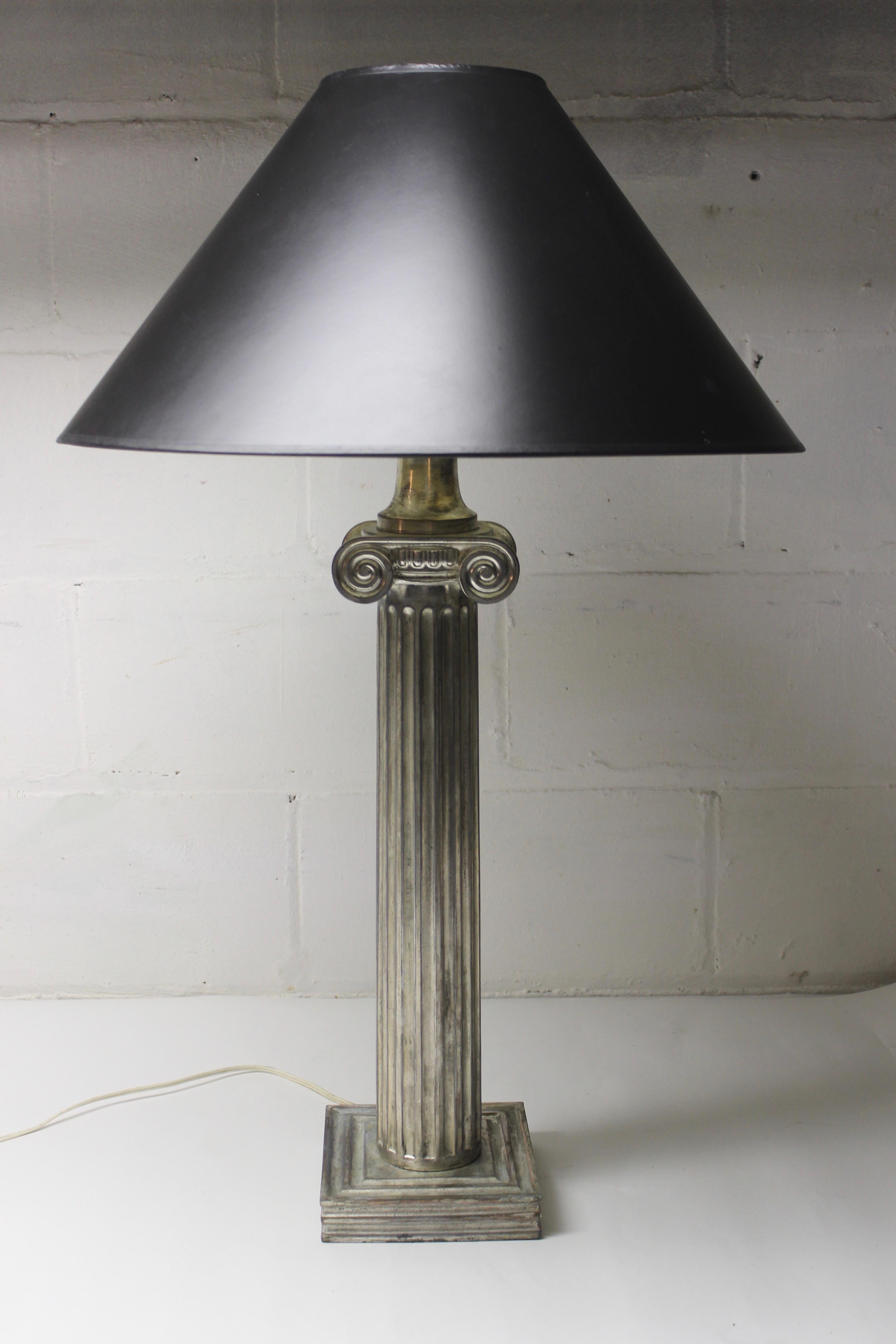 Metal ionic column table lamp. Works well, shade not included.