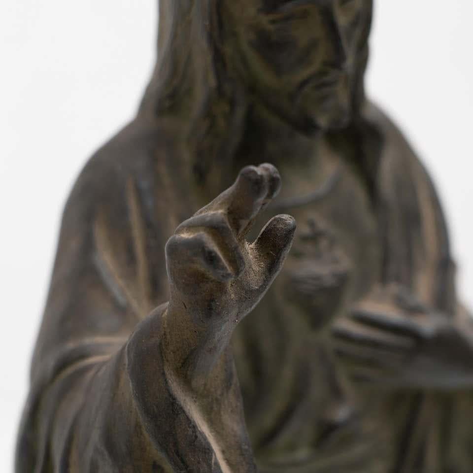 Metal Patinated Ceramic Jesus Christ Memorabilia Figure, circa 1950 In Good Condition In Barcelona, Barcelona