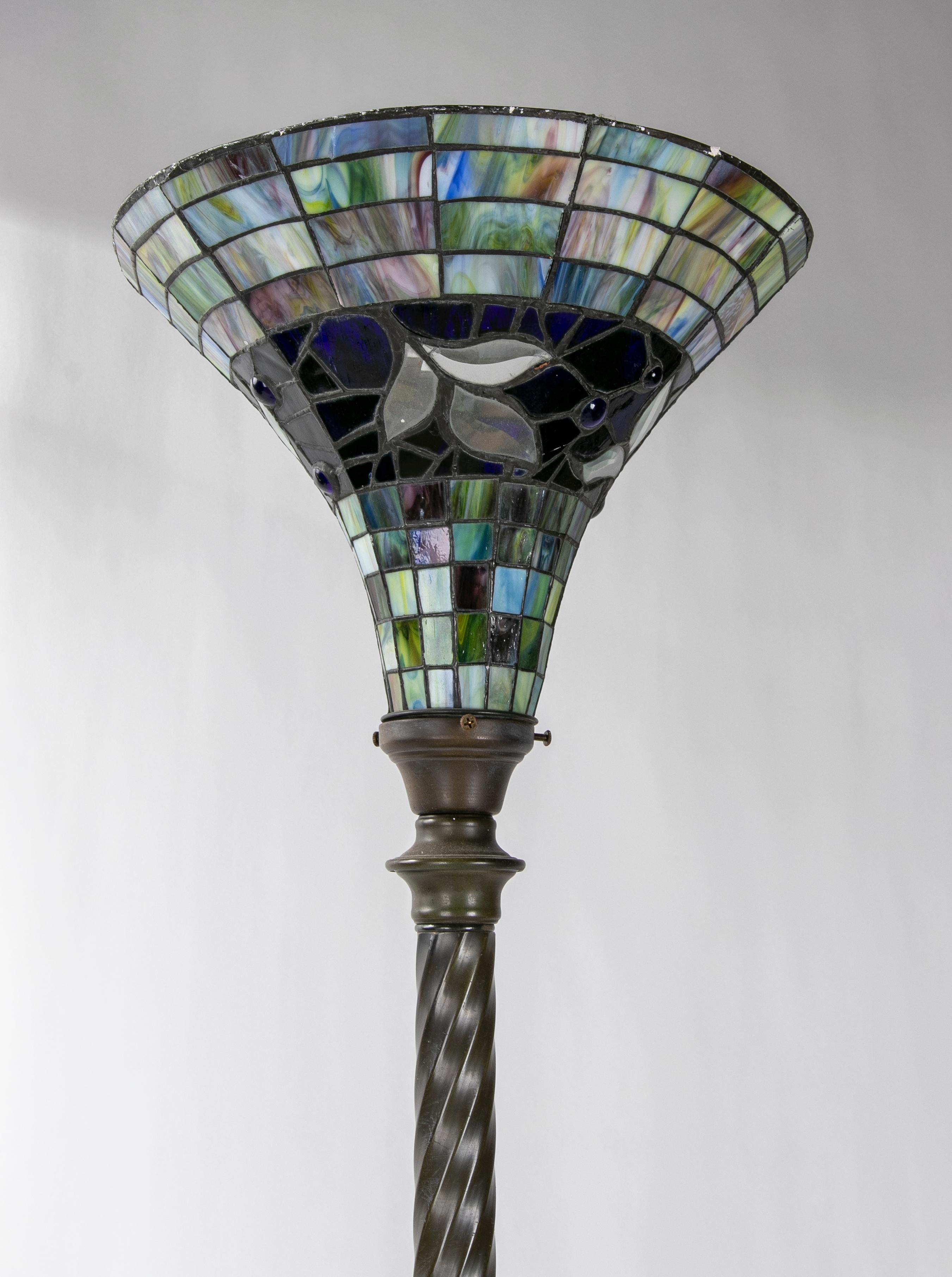 Metal lamp top with coloured crystals.