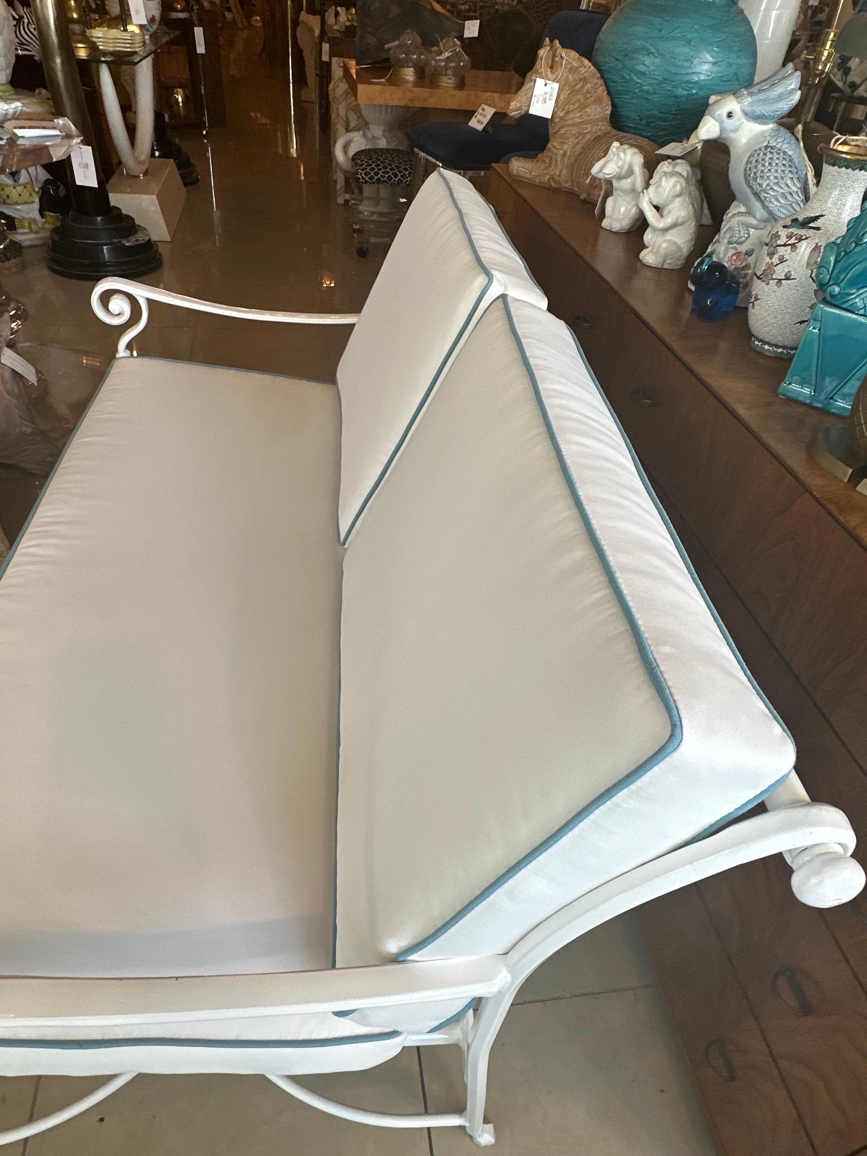 Beautiful vintage metal loveseat sofa for your patio outdoor sunroom. This has been completely restored! Newly powder-coated in a fresh white. All new custom cushions including new foam, zippers, Sunbrella white outdoor fabric with Sunbrella blue