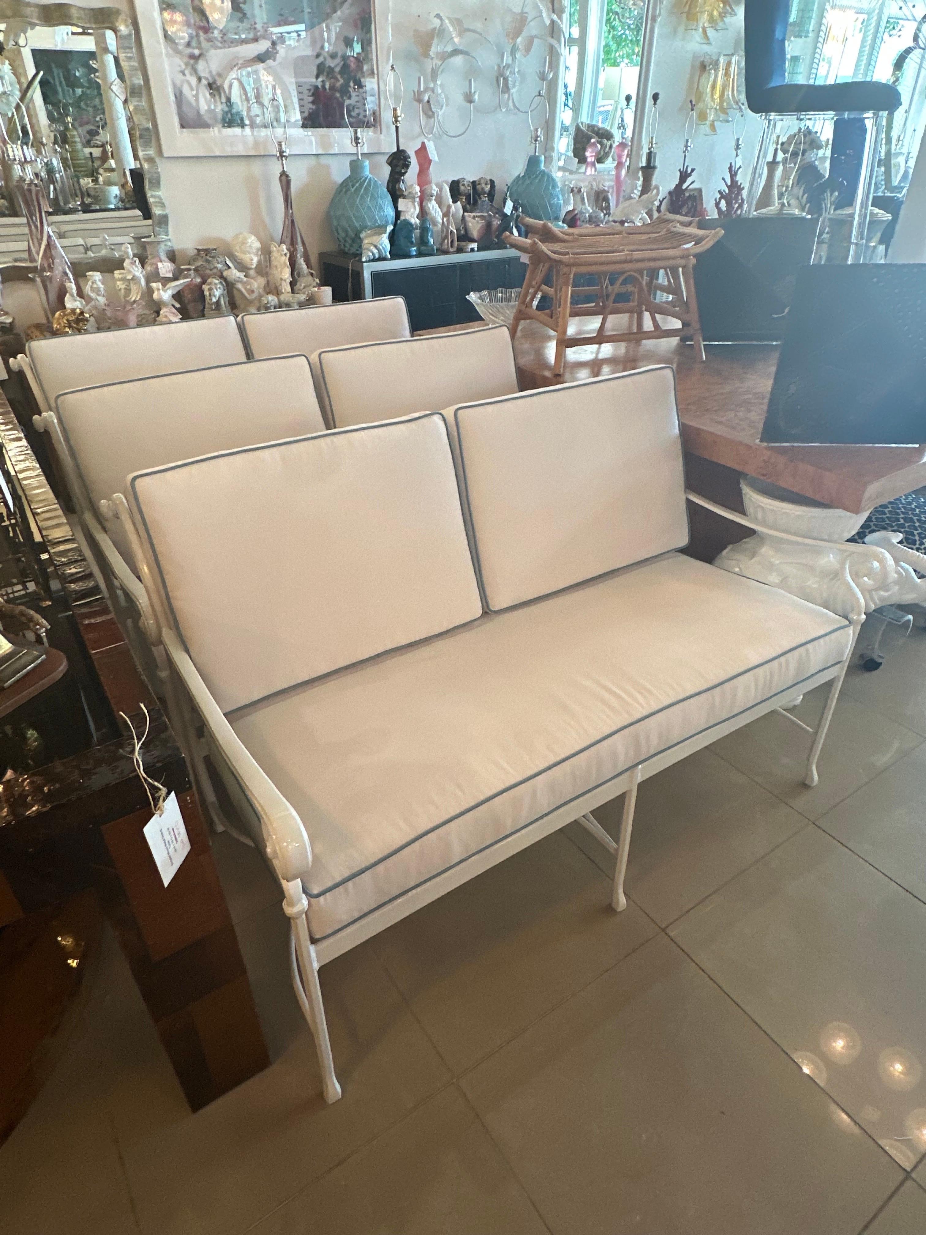 Beautiful vintage metal loveseat sofa for your patio outdoor sunroom. This has been completely restored! Newly powder-coated in a fresh white. All new custom cushions including new foam, zippers, Sunbrella white outdoor fabric with Sunbrella blue