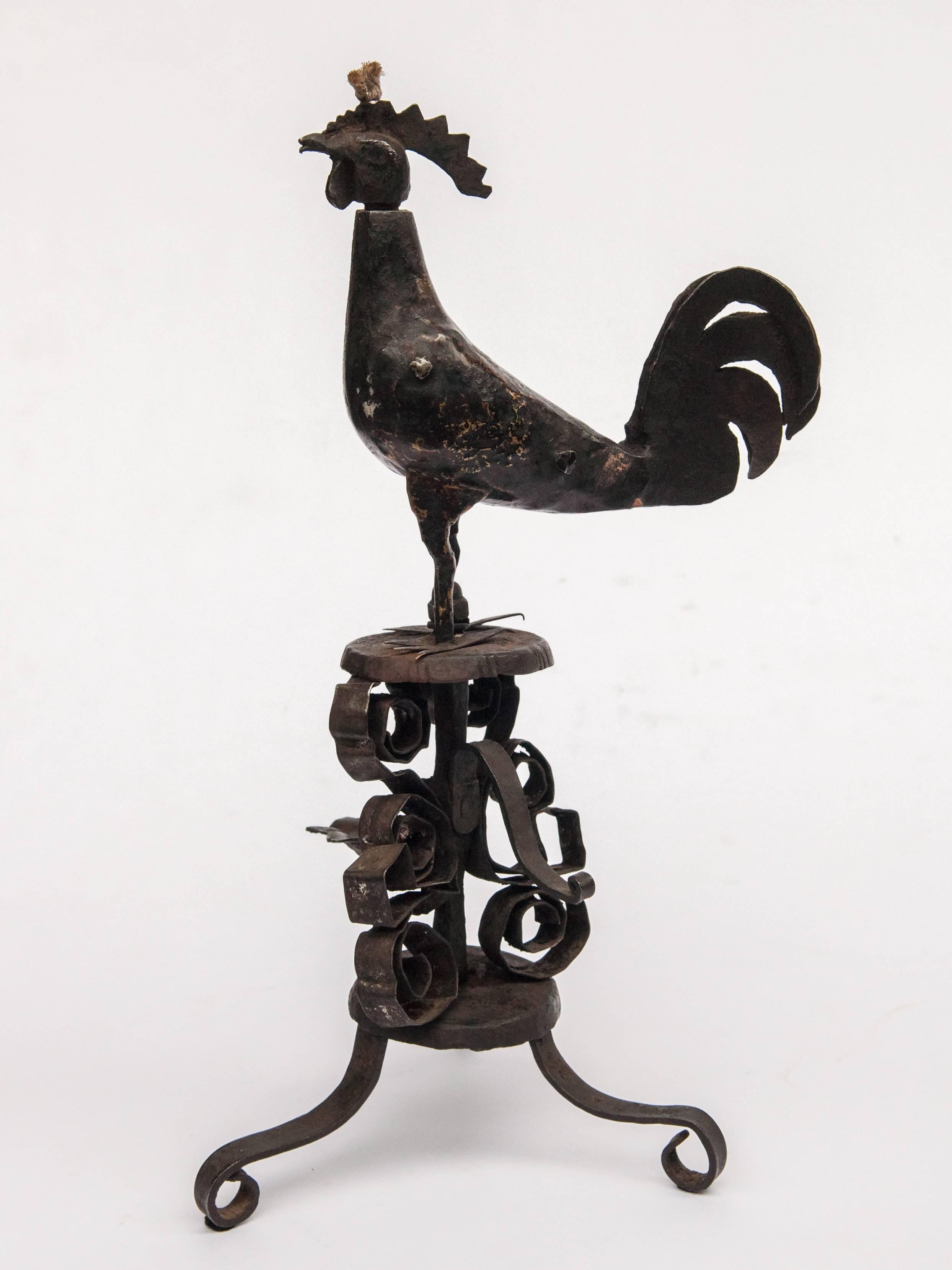 Metal oil lamp from Himalaya Nepal. Rooster motif, mid-late 20th century.
Offered by Bruce Hughes.
Charming folk art lamp fashioned of wrought iron by a village blacksmith using basic tools. It comes from the hills of west central Nepal. The