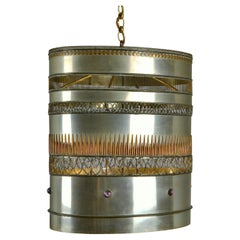 Metal Oval Pendant with applied Brass and Copper Work Decoration
