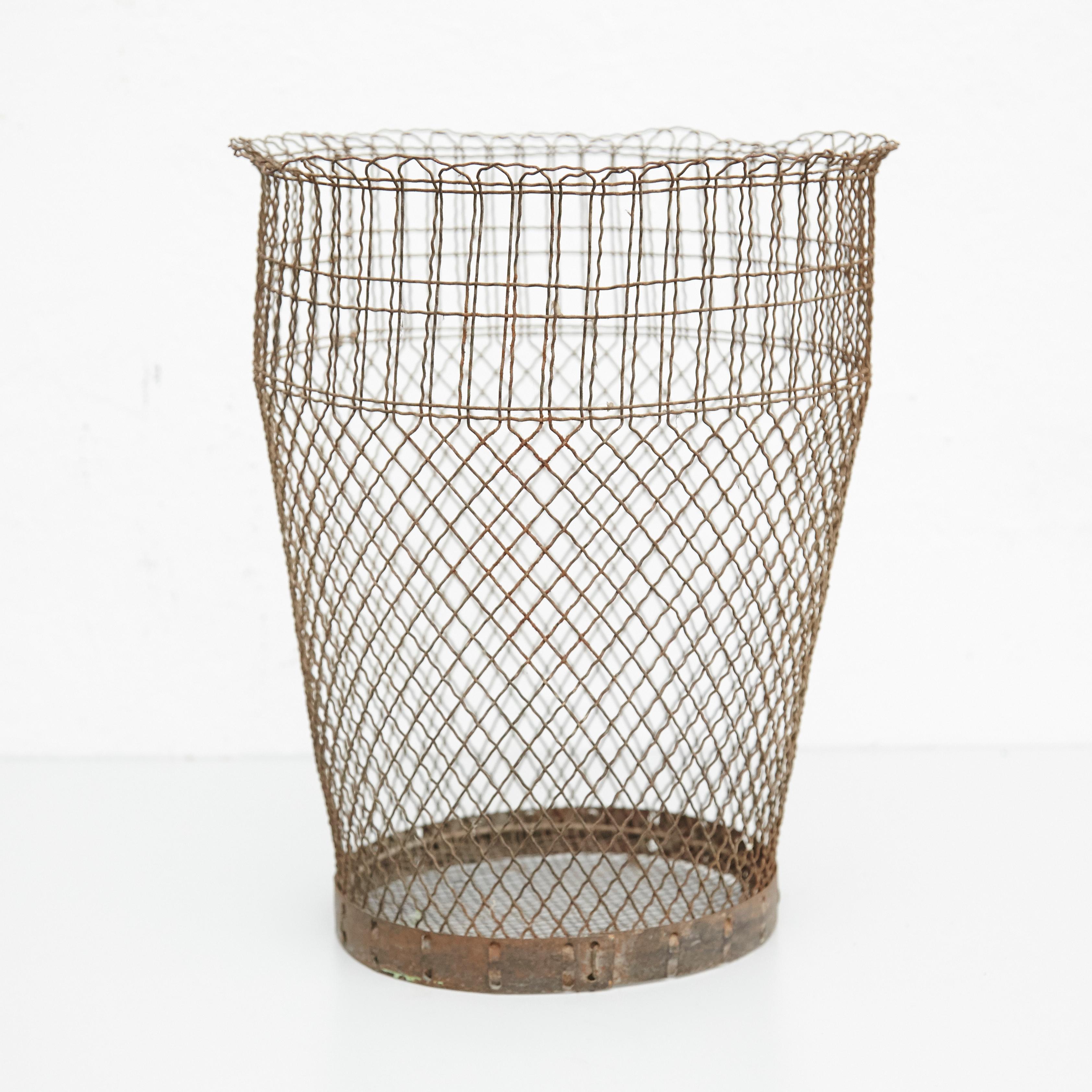 Metal paper bin made by wire woven in a classic cross-hatched pattern completed by a solid ring. 
Unknown manufacturer, France,
circa 1940

Materials:
Metal

Dimensions: 
Diameter 33 x 35 height cm

In original condition, with minor wear