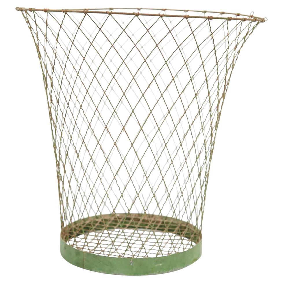 Metal paper bin made by wire woven in a Classic cross-hatched pattern completed by a solid ring.
Unknown manufacturer, France,
circa 1940

Materials:
Metal

Dimensions: 
33 diameter x 32 height cm

In original condition, with minor wear