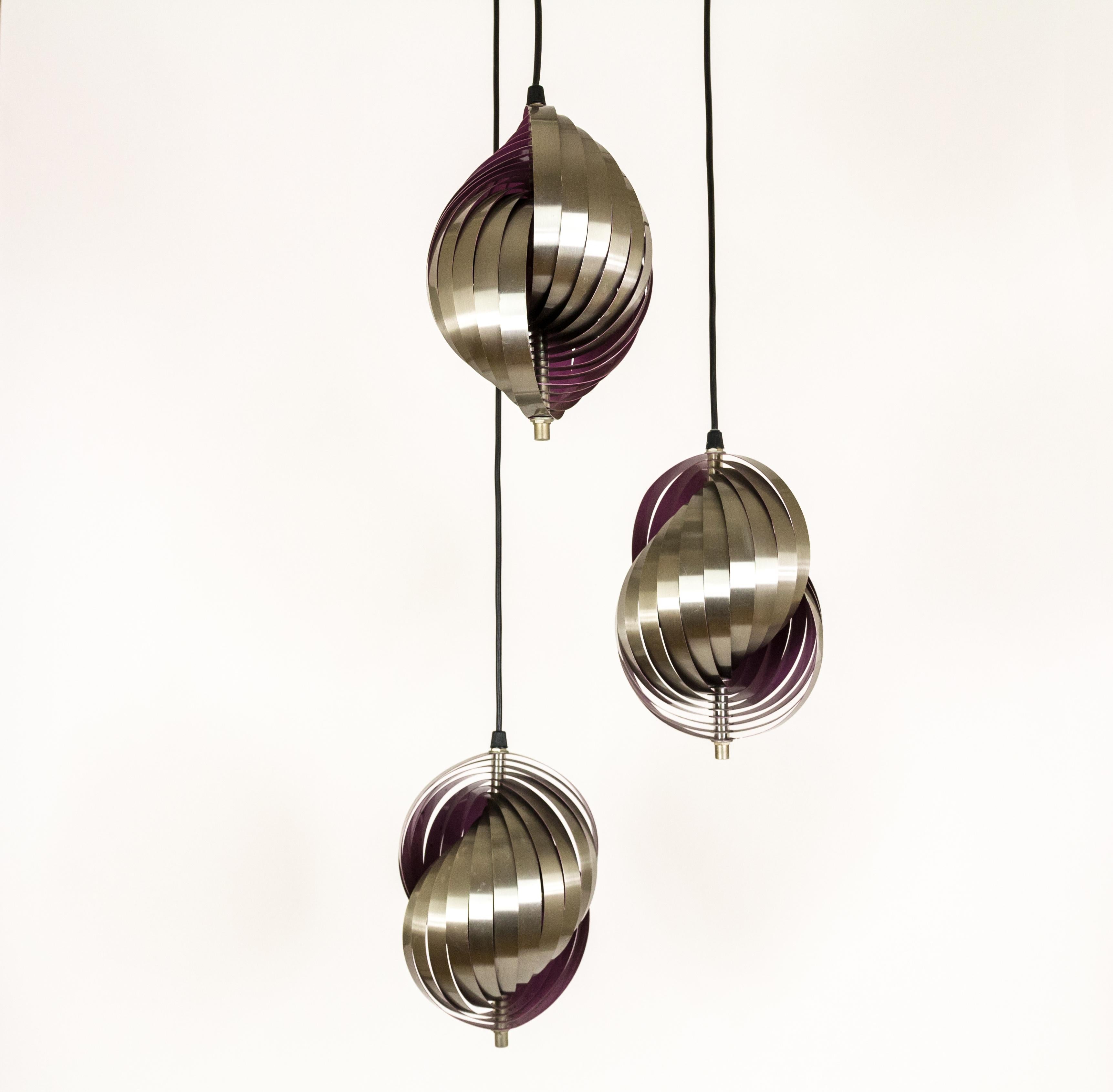 Henri Mathieu designed this highly original fixture, circa 1970. It consists of three hanging pendants. Each pendant is approximately 19 cm / 7.5 inches in diameter and 26 cm / 10 inches high. The three elements can be hung at different