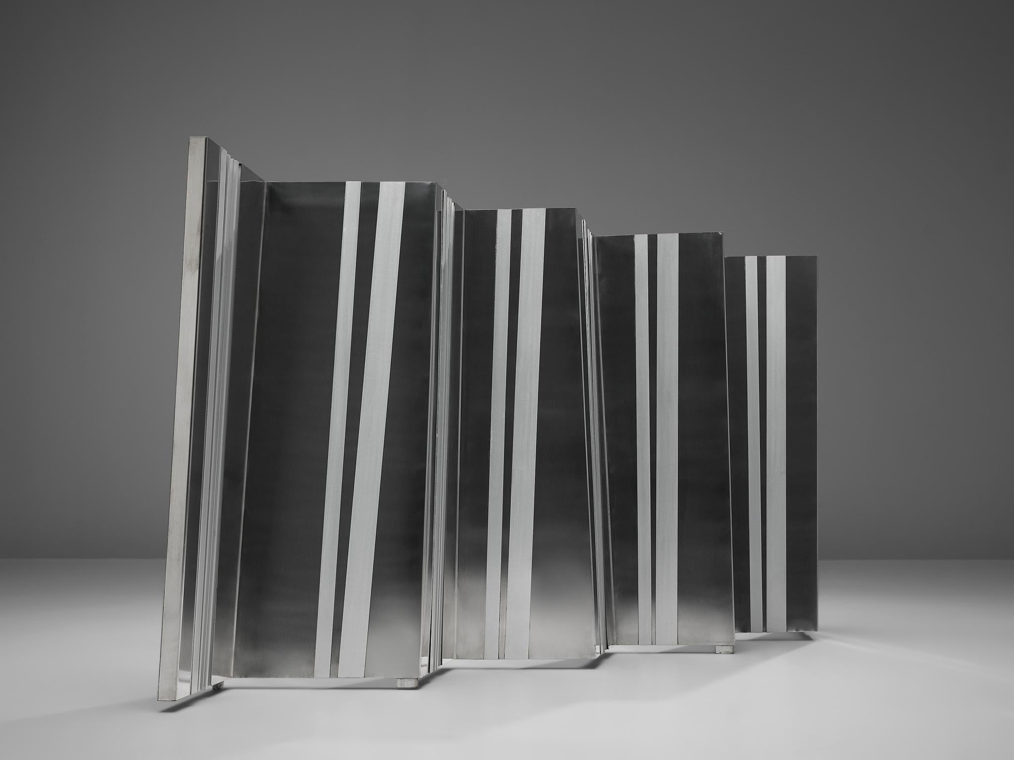 Salvatore Messina, room divider or wall unit, aluminum, Italy, 1960s

Salvatore Messina (1916–1982) explored the themes of movement and spatial concepts through his innovative metal sculptures. The three-dimensionality of this piece is highlighted
