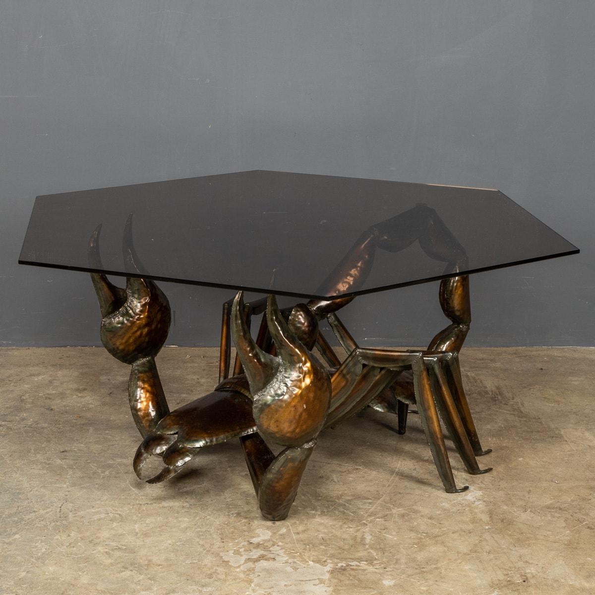 An unusual metal sculpture of a Scorpion supporting a large hexagon of smoked glass creating a striking coffee table. Of lovely proportions, a wonderful piece of interior design from the latter part of the last century, a real statement