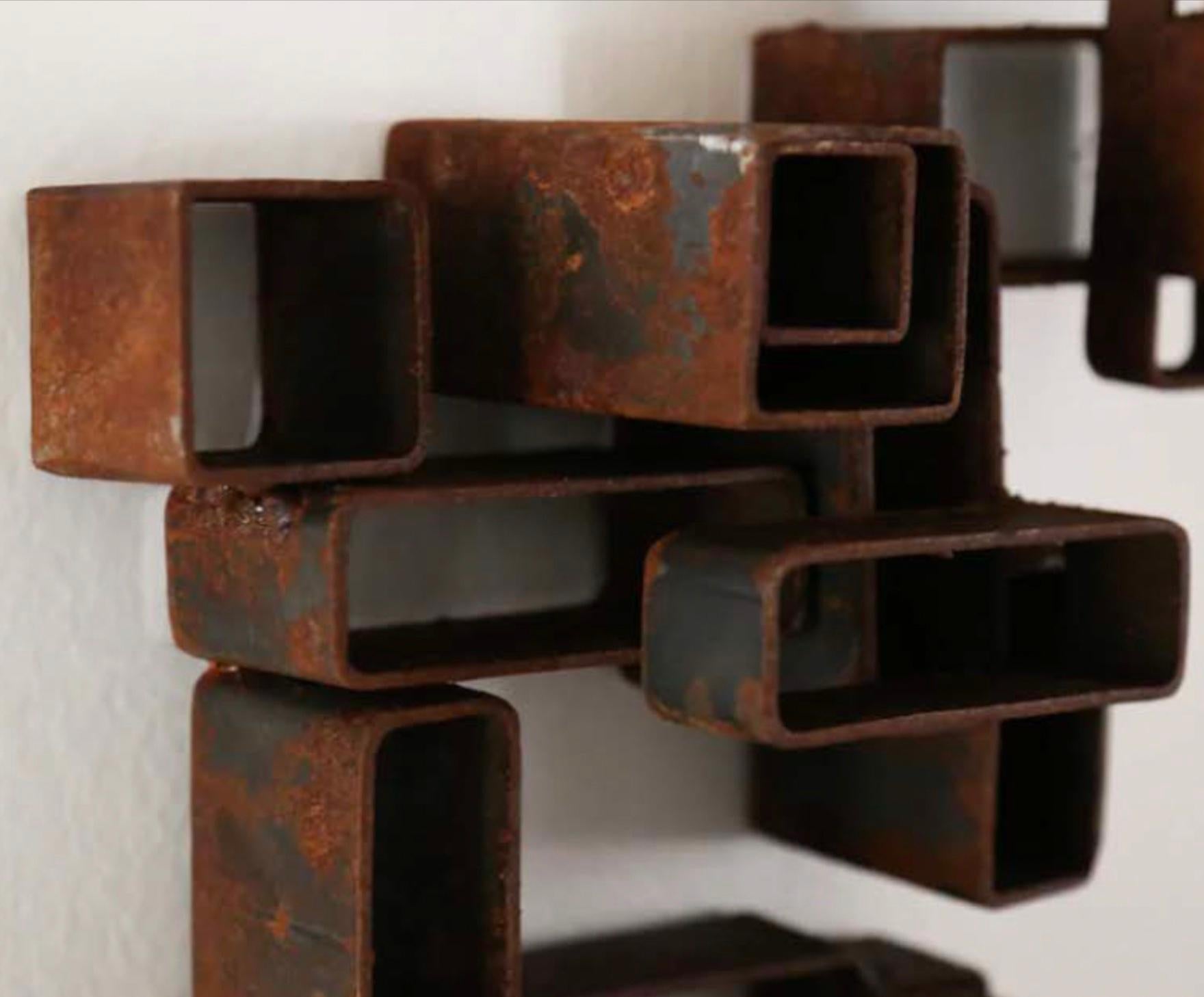 Hand made Metal Sculpture 
stacked pieces welded together 
with natural patina 