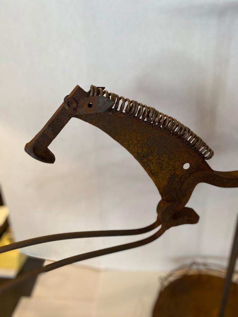 Original sculpture of a horse (in stride) umbrella stand made by Bill Heise Look him up on the internet, He used all kind of iron metal Tis has to be the best!
The artist has passed.