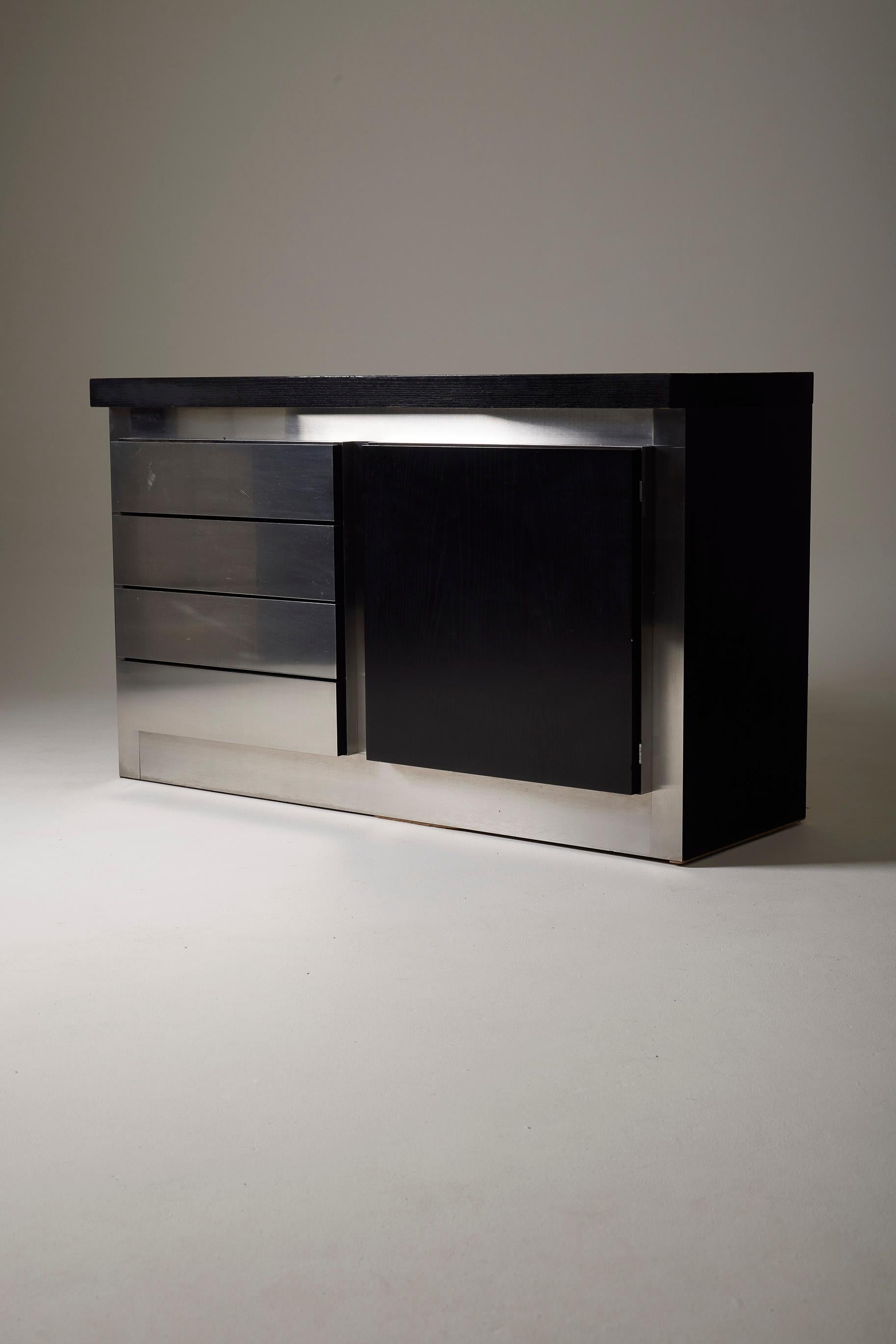 Beautiful modernist sideboard in blackened oak and aluminum by designer Lodovico Acerbis for Acerbis in the 1970s. This sideboard features 2 storage compartments: one with a swing door and one with 4 drawers (lined interior). A very fine piece in