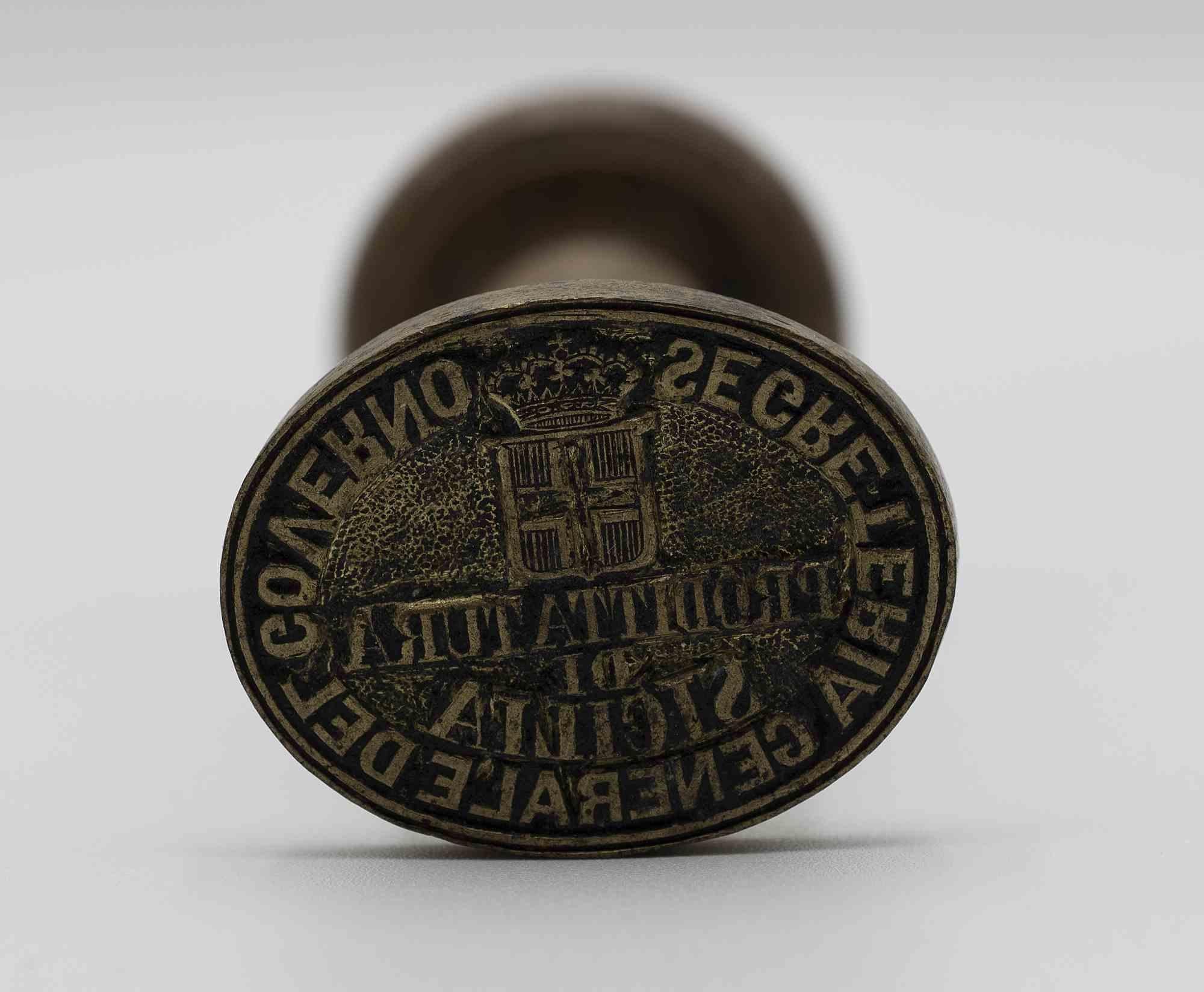 Metal stamp with wooden handle exhibited at the congress and systematic exhibition on Italian Risorgimento Art.

Text of the stamp General secretariat of the government. Prefecture of Sicily. 

Savoy coat of arms.

Measures: h10 x 4