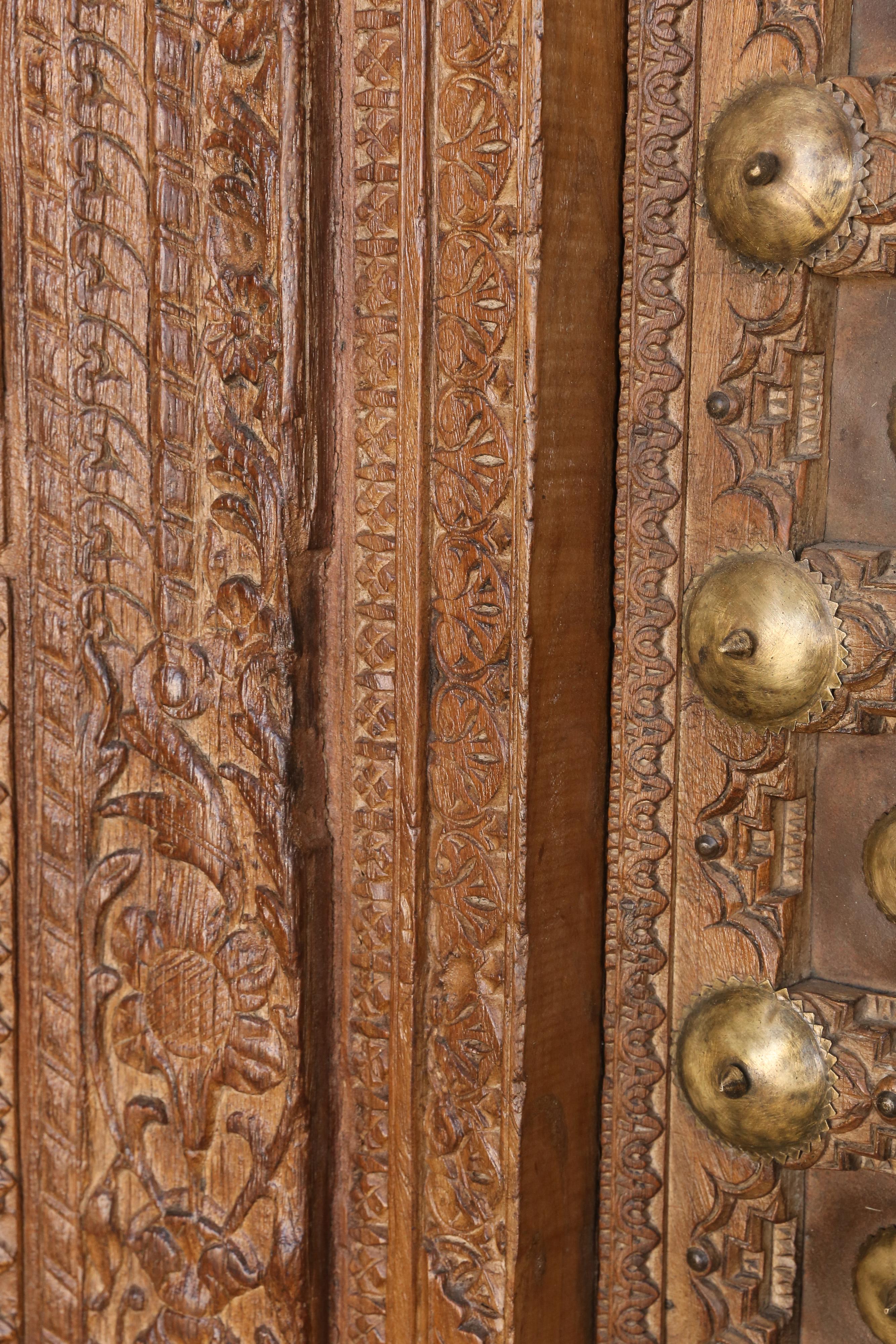 Mid-19th Century Metal Studded Highly Carved Solid Teak Wood Entry Door of a Temple Priest Home