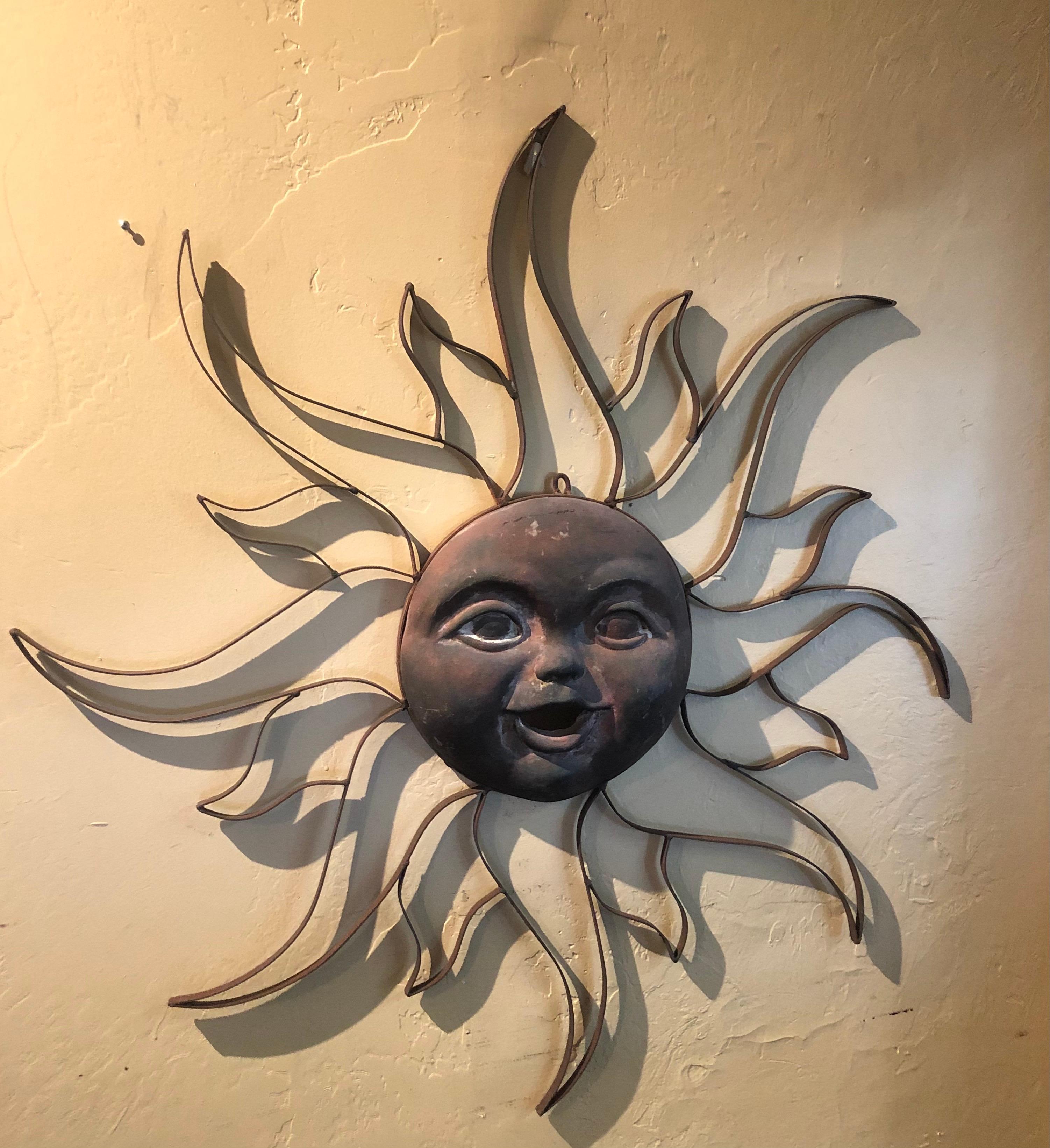 A very cool handmade metal sun sculpture / wall hanging, circa 1970s. The piece is 39.5