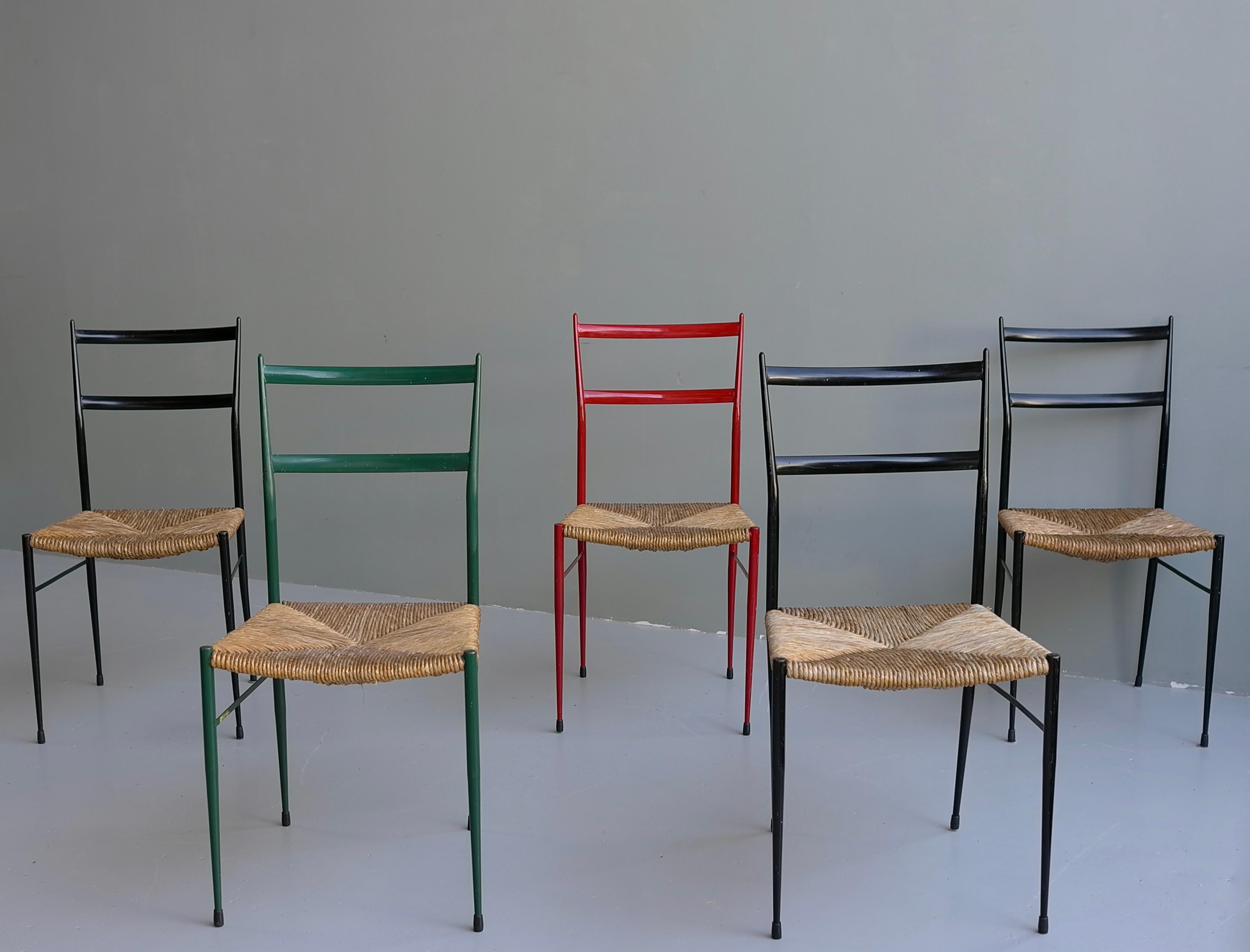5 metal superleggera chairs attributed to Gio Ponti. These chairs where sold in the famous Dutch warehouse ''De Bijenkorf''. That Gio Ponti designed.

We have 4 pieces in stock in there original color, 3 black, 1 green(turqoise), the red is
