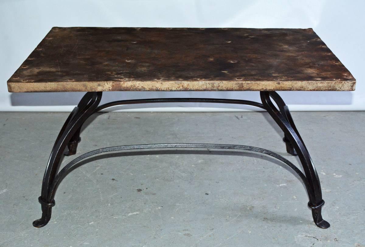 Rustic antique metal top on contemporary cast iron metal base coffee table. Wonderful patina.
Great to use indoor or outdoor on porch patio or garden.
Base: 21