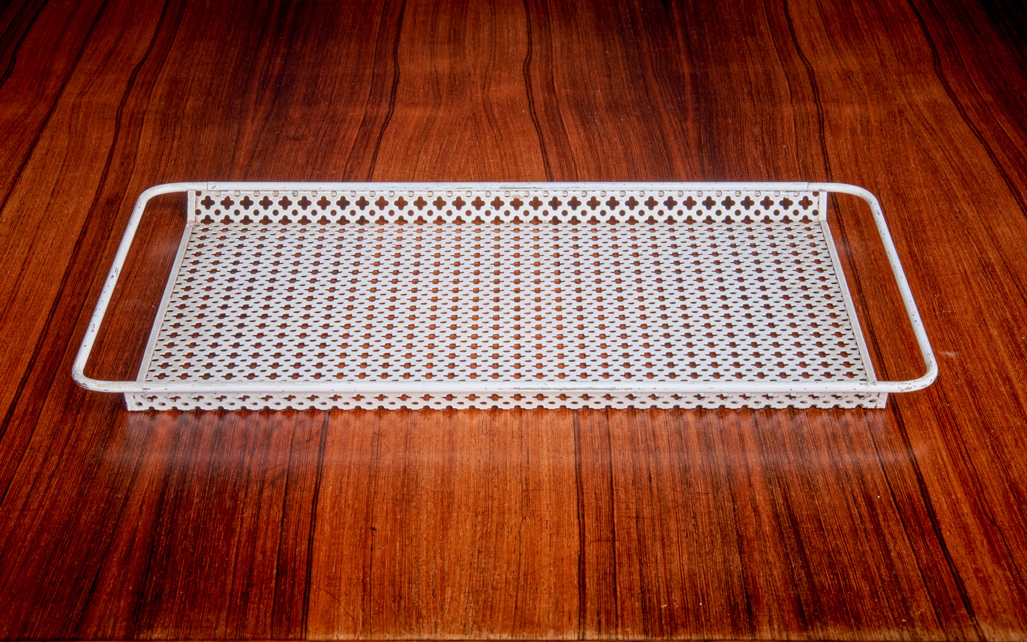Tray by Mathieu Matégot in perforated metal sheet.

