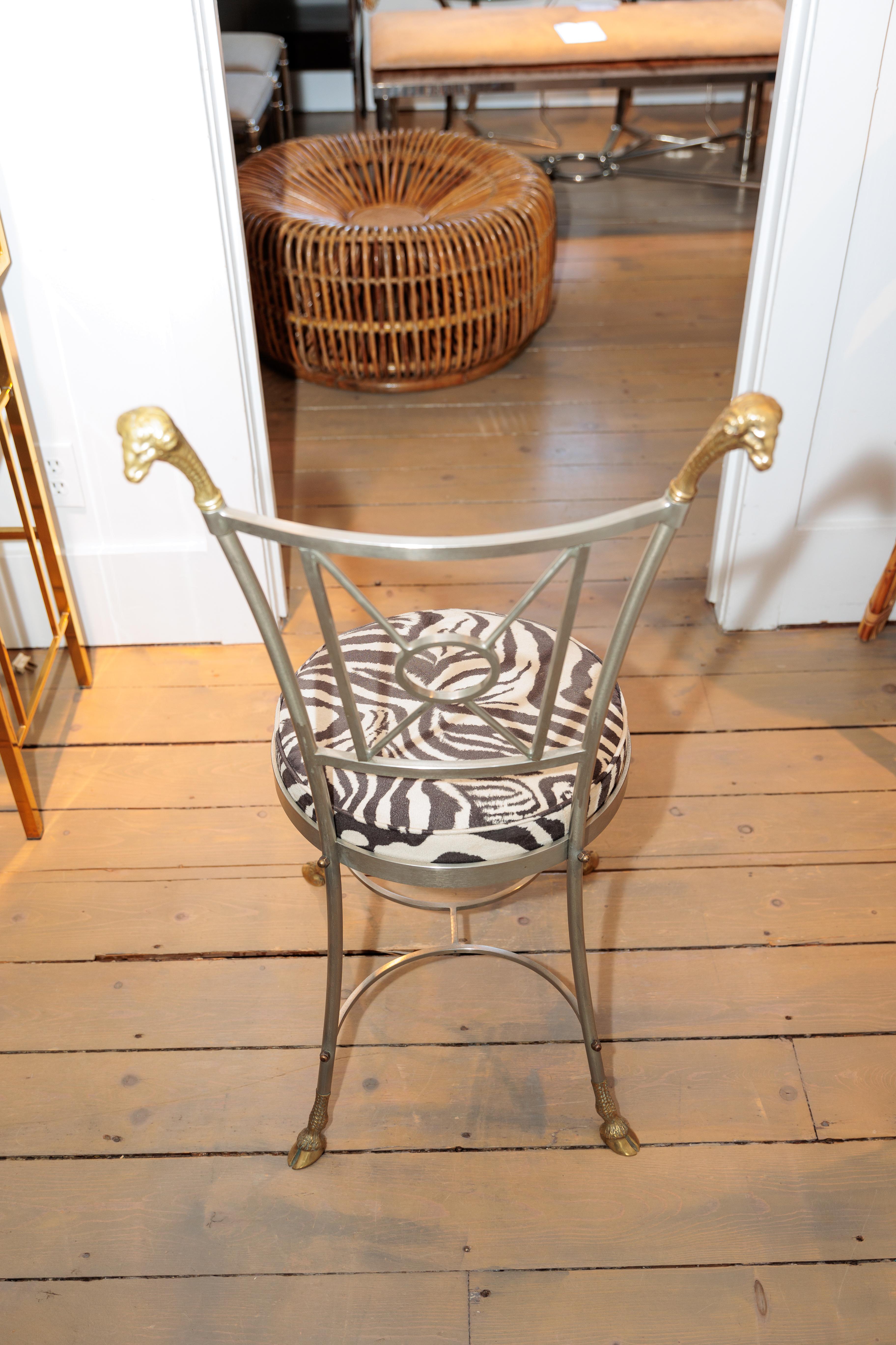 This chair has such unique details with Ram's head and hoofs.
Upholstered in cotton Zebra pattern.