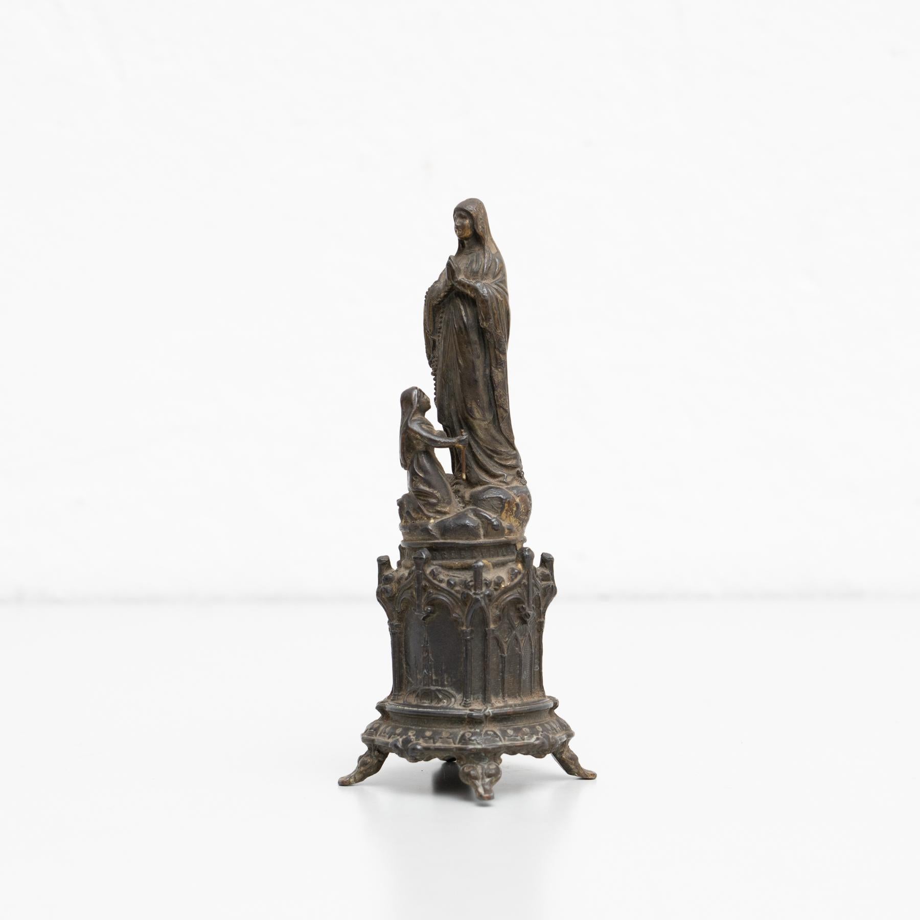 'Miracle du cierge' Lourde metallic virgin statue.

Made France, circa 1950.

In original condition, with minor wear consistent with age and use, preserving a beautiful patina.

Materials:
Metal.
 