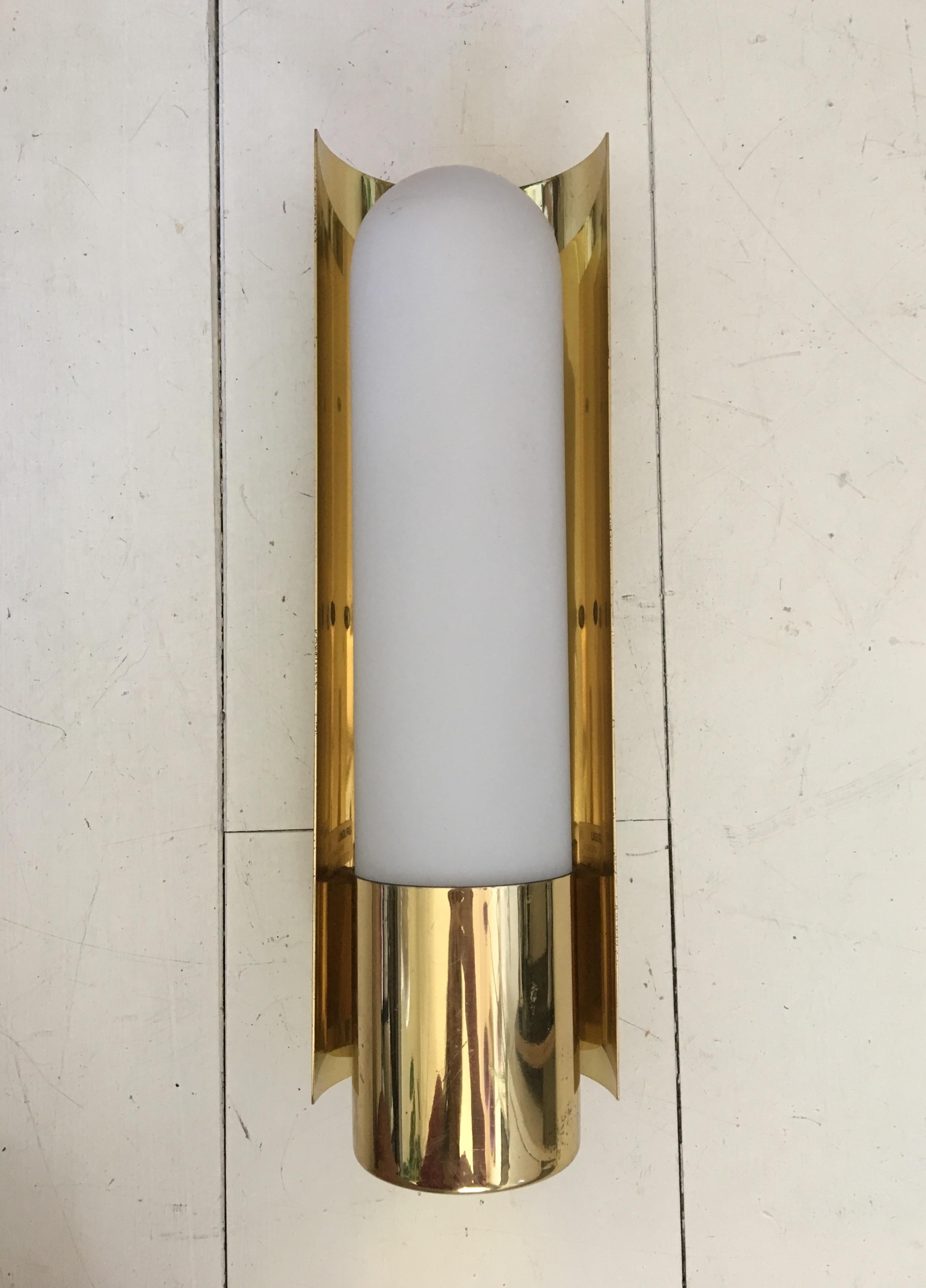 Wonderful brass and opaline glass wall light, which remains in very good condition. The piece is marked with the manufacturer's sticker. NOW TEMPORARY DISCOUNT PROMO CODE AVAILABLE, SEND MESSAGE FOR MORE INFORMATION!