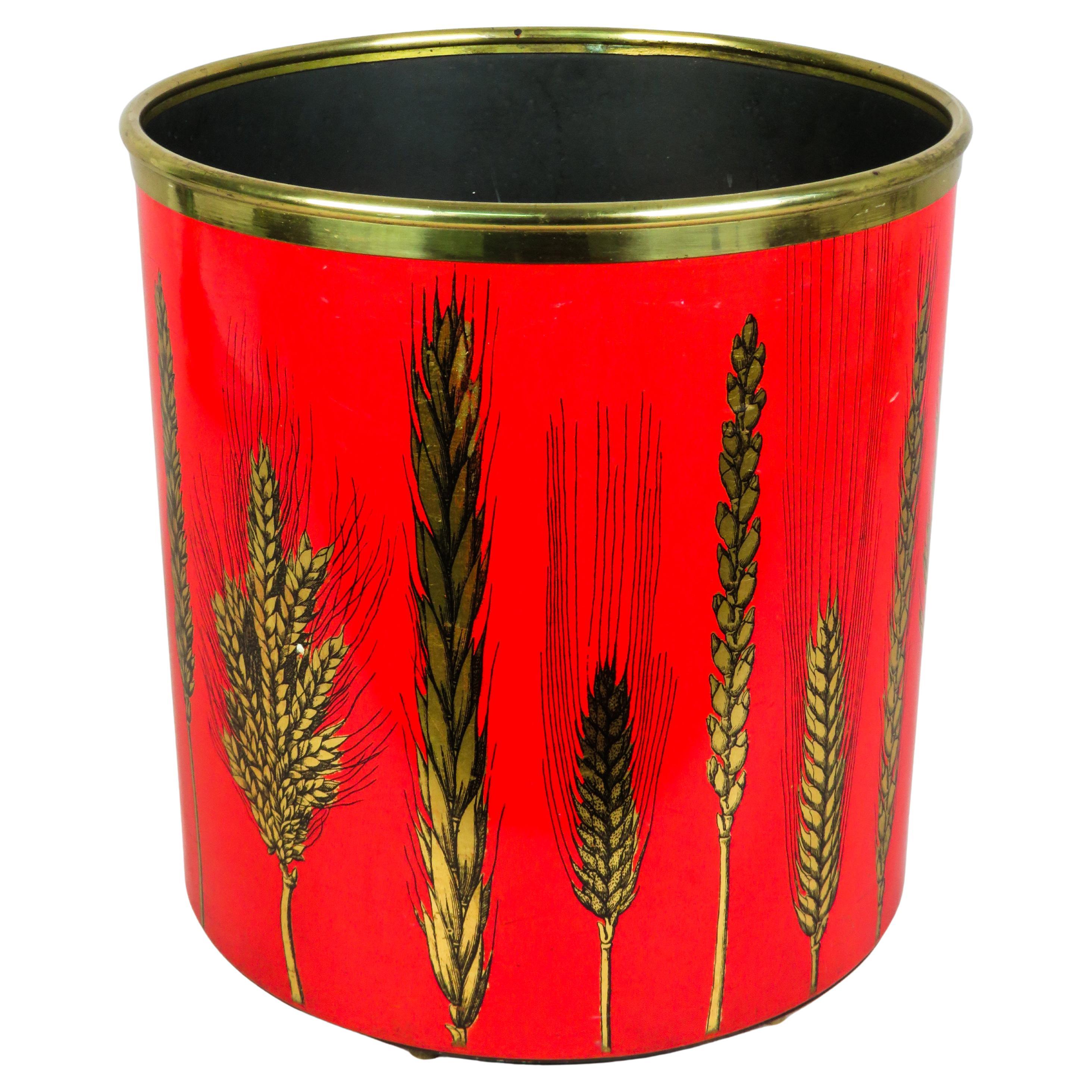 Metal wastebasket with a gold herringbone design and red lacquered base For Sale
