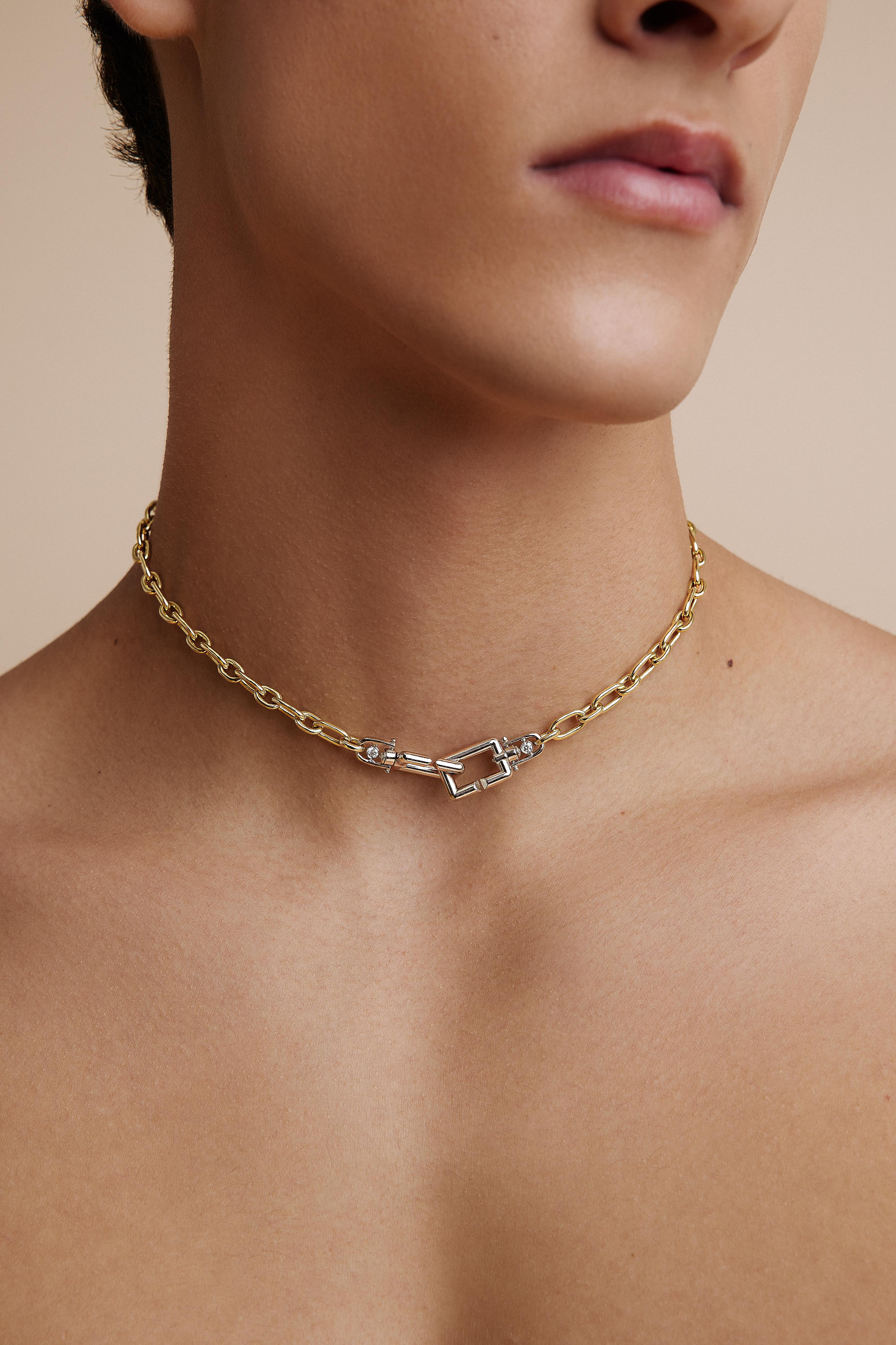 Experience the seamless fusion of functionality and artistry with our 18K duotone gold necklace—a true testament to sophistication and timeless elegance. Allow us to introduce our Bold Lynx Diamond Necklace, where the interplay of tones adds a layer