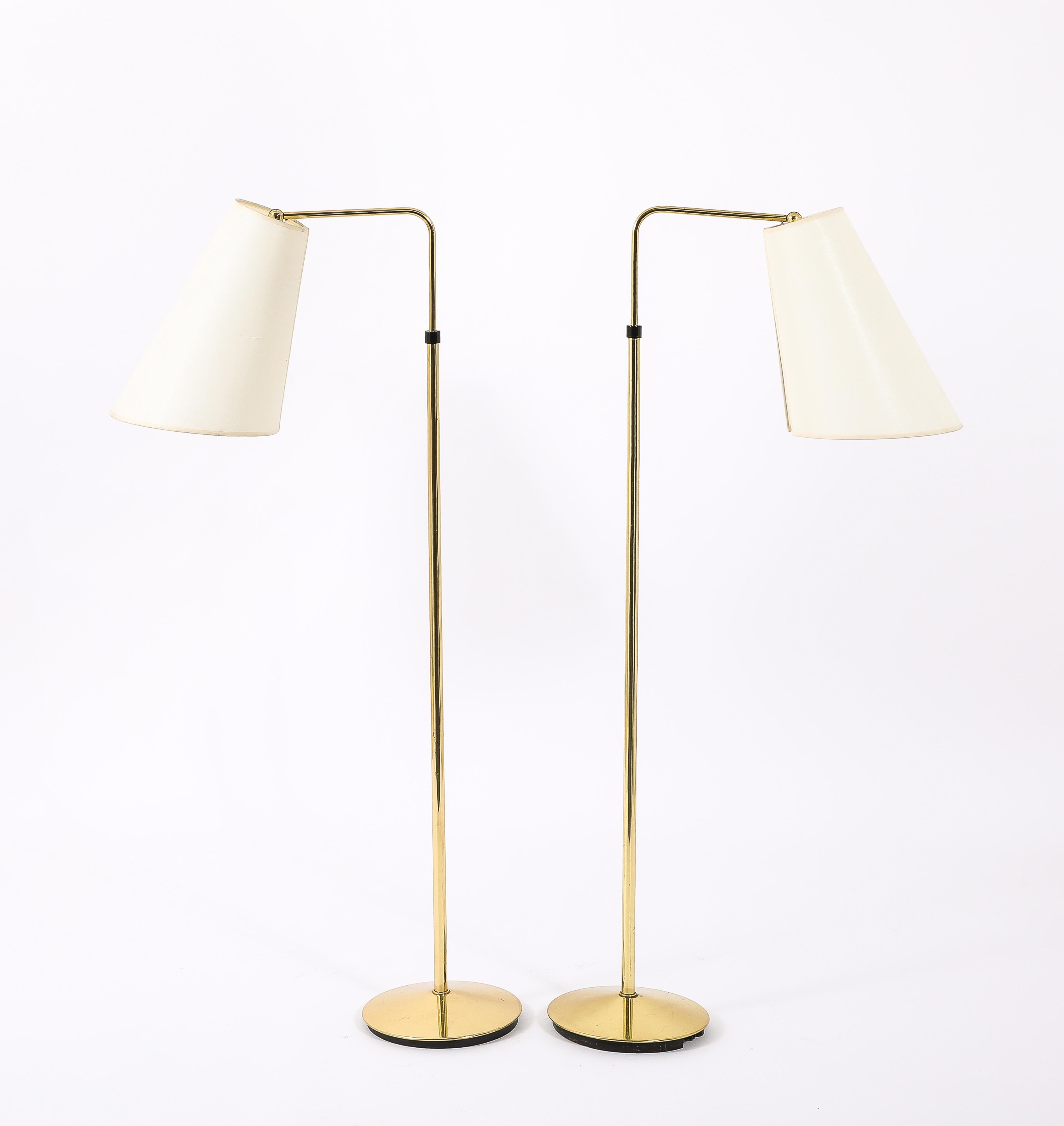 Brass reading floor lamps by Metalarte in brass, fully adjustable in height from 50” to 70”. Shades included
